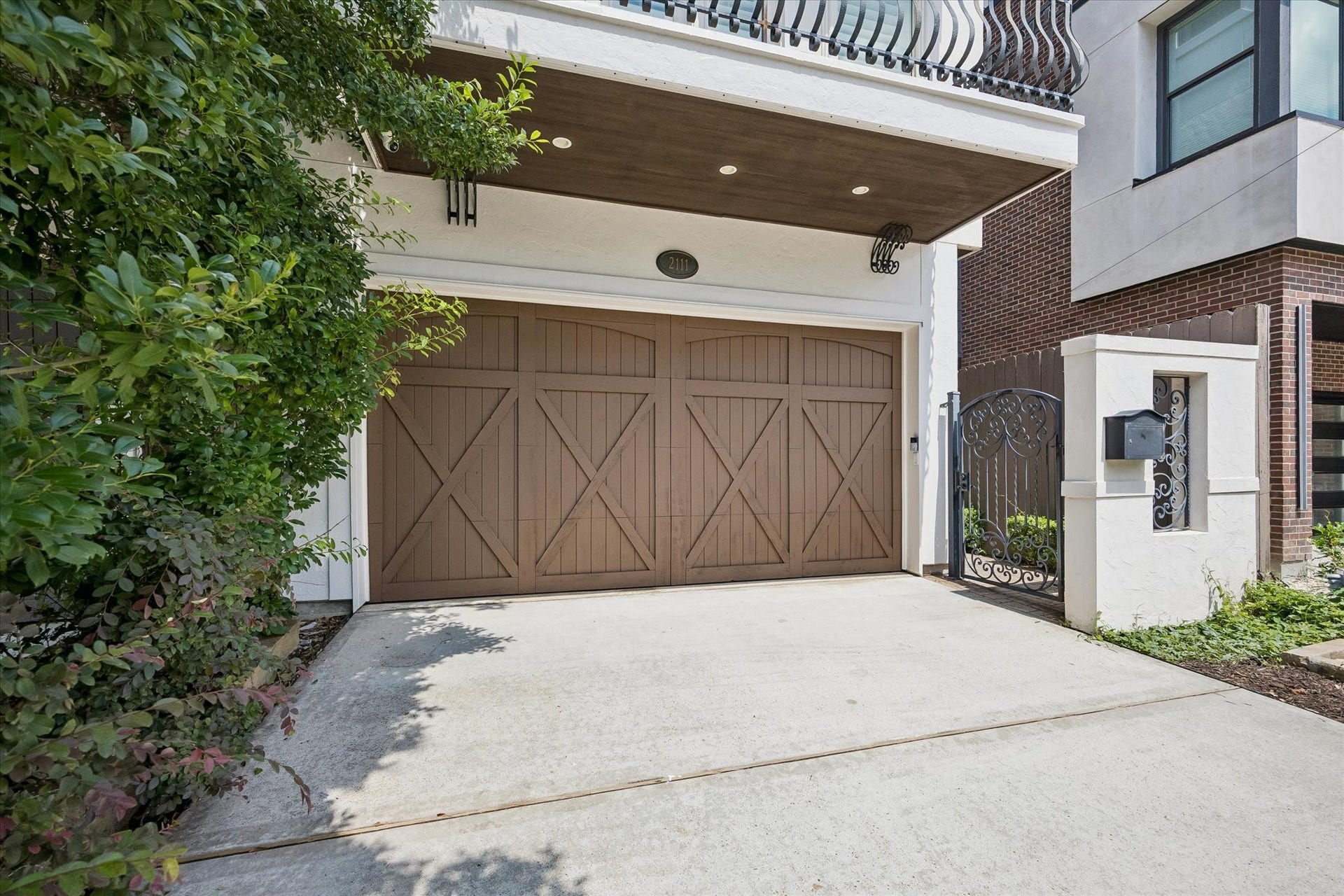 2111 Huldy Street, Houston, TX 77019 A double-wide driveway and two-car attached garage with epoxy flooring and extra storage offer both luxury and everyday convenience.