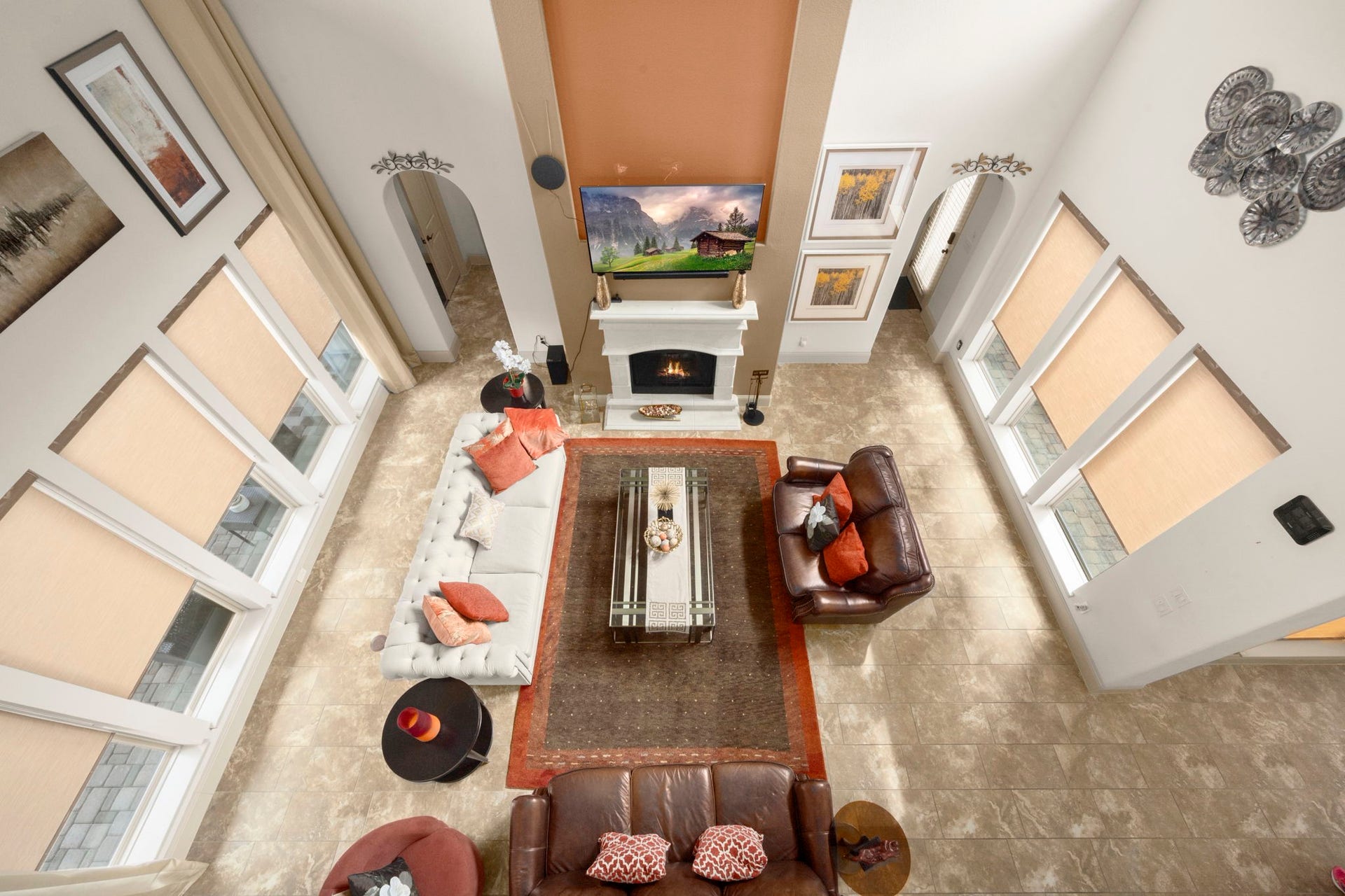 5103 Jackson Ponds Court, Sugar Land, TX 77479 This spacious living room features high ceilings, large windows with abundant natural light, and a central fireplace.
