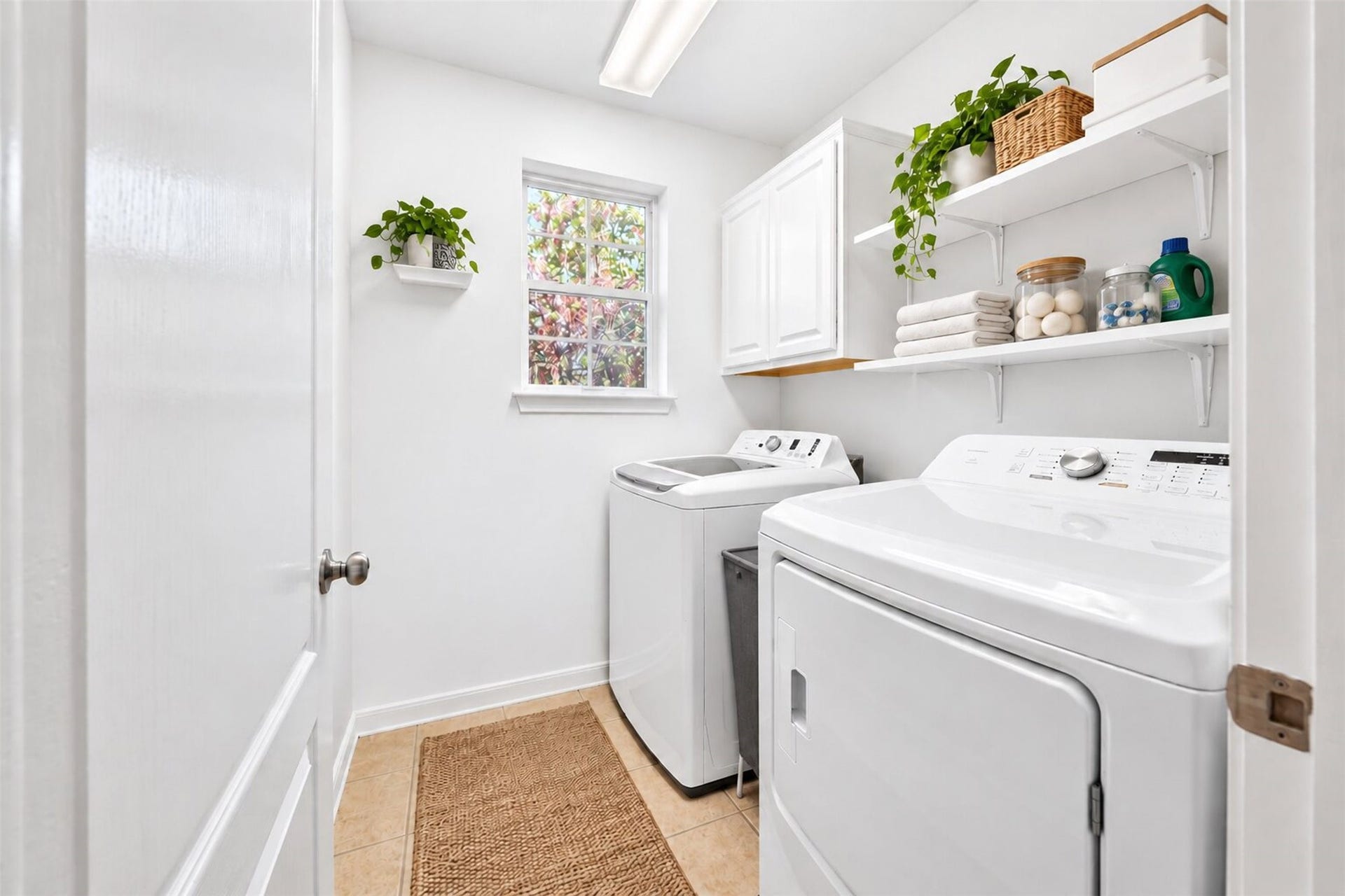 11235 Stoney Meadow Drive, Houston, TX 77095 Laundry room boasts ample storage space and window.