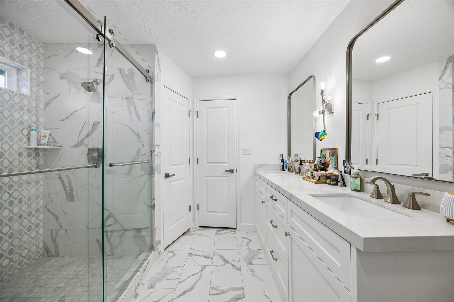 5914 Y Street, Katy, TX 77493 Another view of primary bathroom renovation boasting custom tile work in shower plus two spacious walk-in closets!