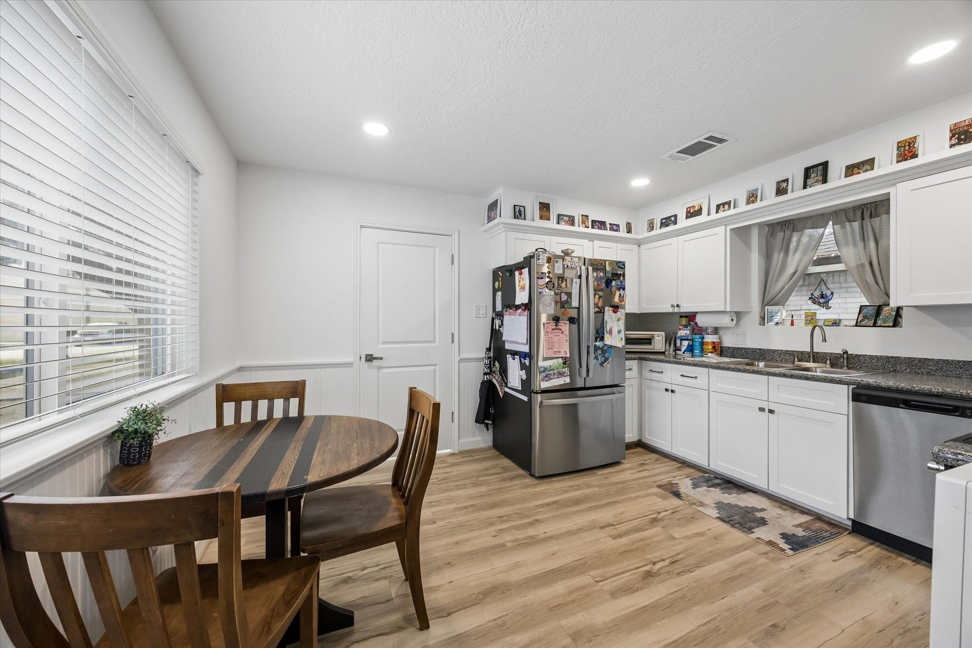 5914 Y Street, Katy, TX 77493 Fabulous chef's kitchen boasts granite counters, high-end LVP flooring & stainless appliances, including refrigerator!