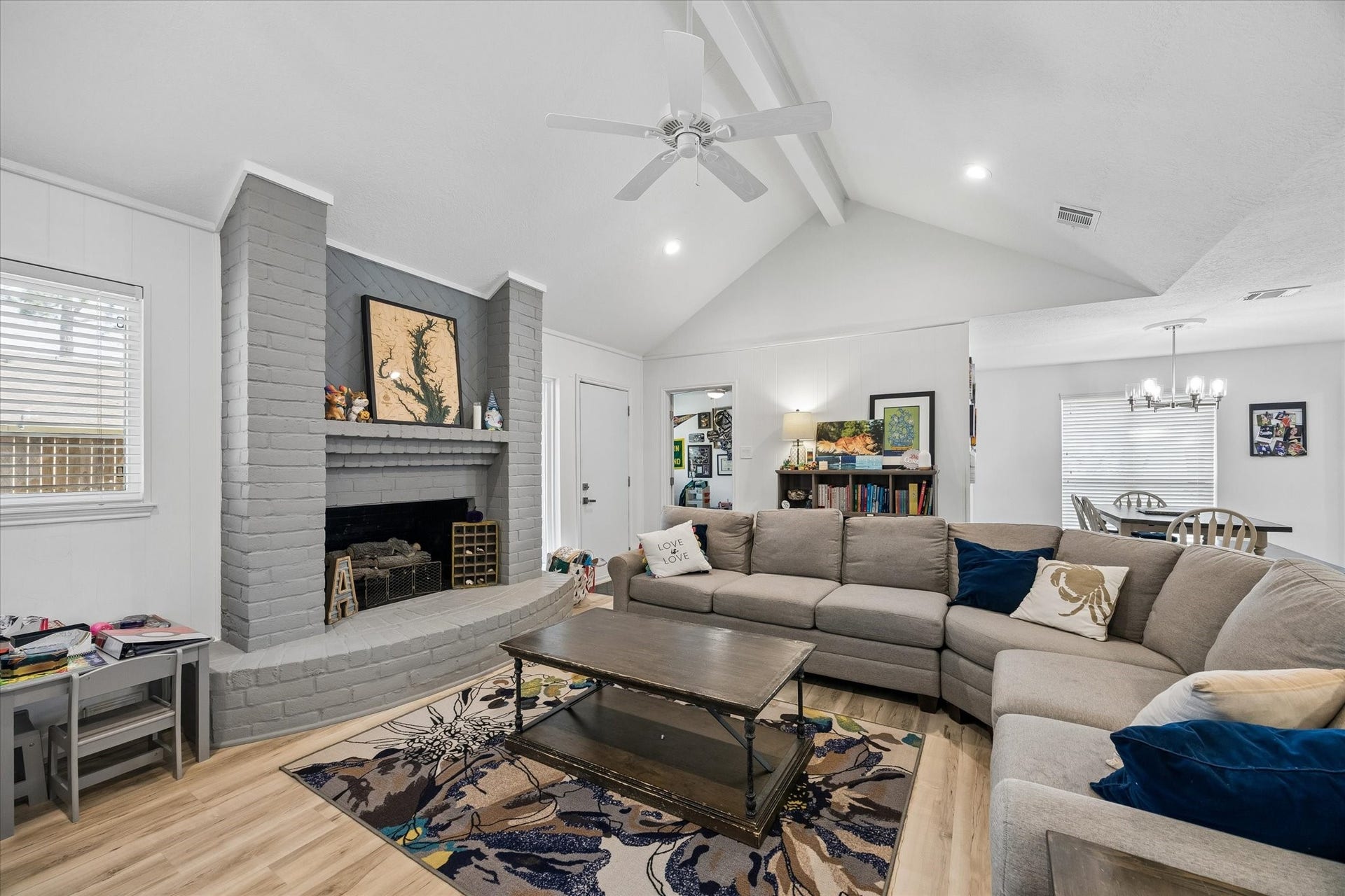 5914 Y Street, Katy, TX 77493 Stately brick fireplace with gas logs & mantle painted in fashionable tones. Note high-end dual pane windows, which were replaced throughout home.