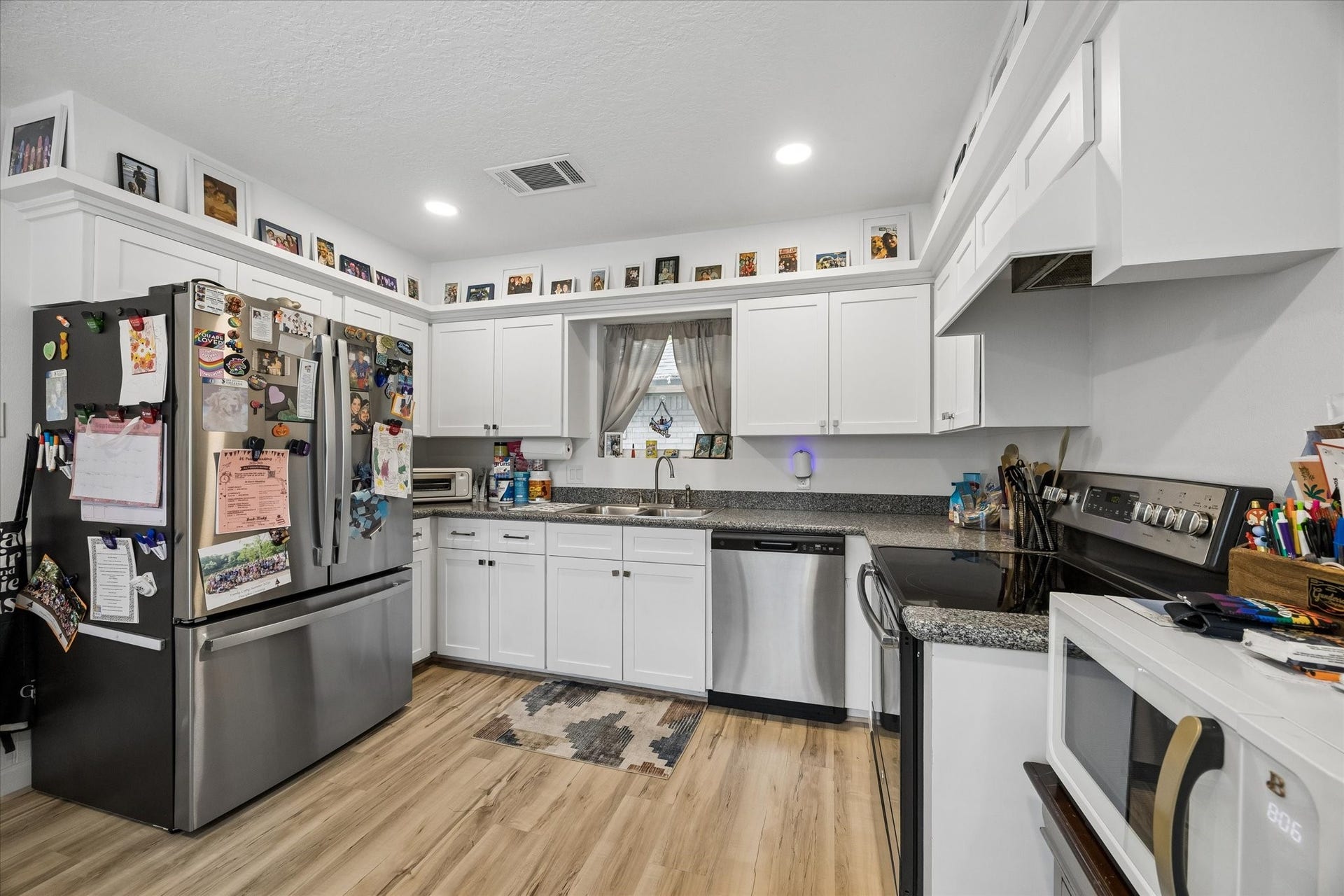5914 Y Street, Katy, TX 77493 Another view of beautiful kitchen, boasting recessed lighting & abundant cabinetry featuring recently replaced cabinet doors.