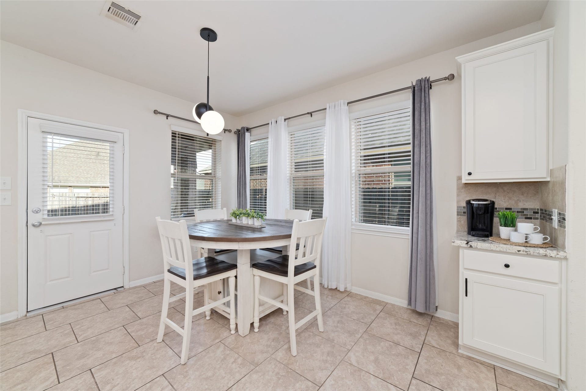 Light filled breakfast area conveniently located just off the kitchen with views of the backyard.