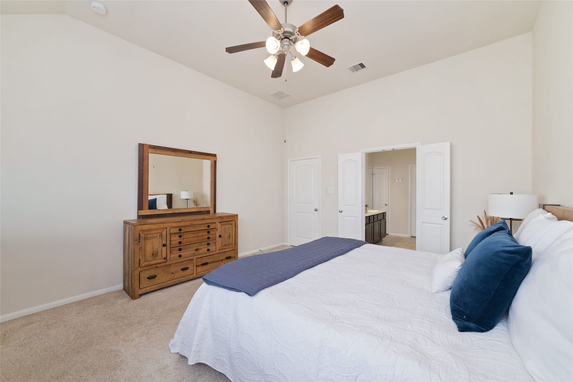 Another view of the spacious primary suite with a spa like en-suite bath.