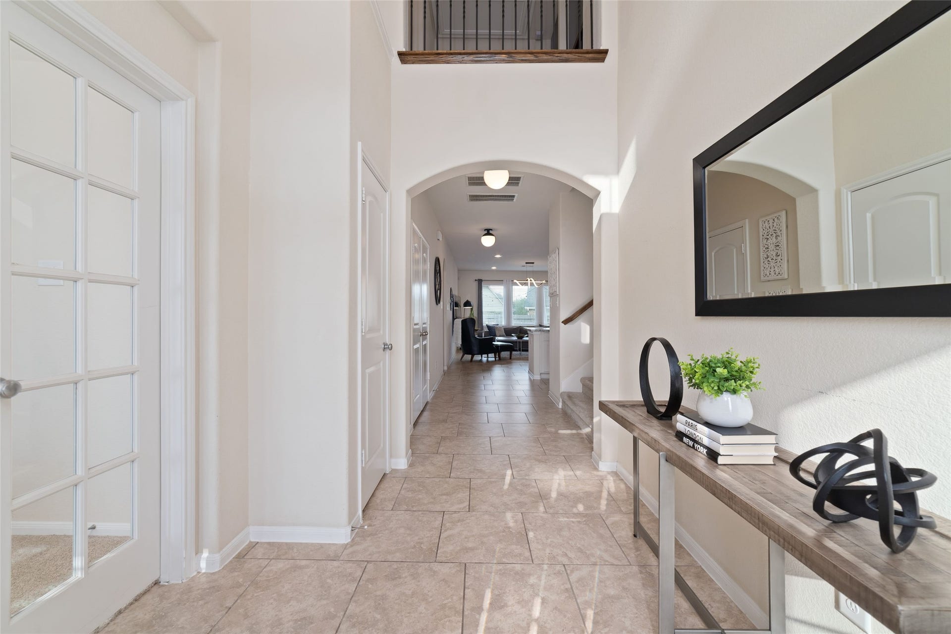 The welcoming front entry opens to tall ceilings and a light & bright interior.