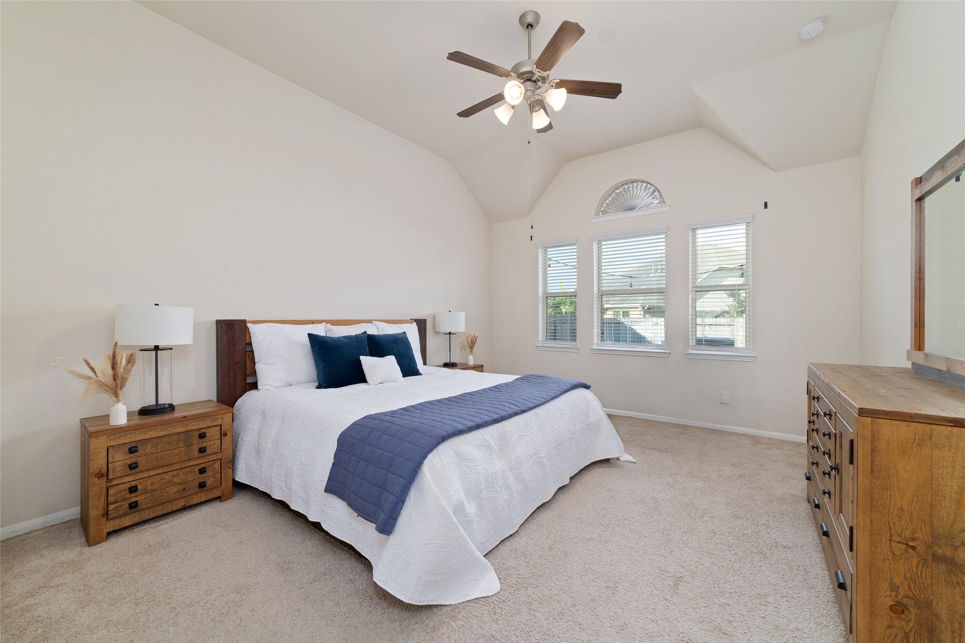 The generously sized primary bedroom offers plenty of room for furniture or a sitting area.