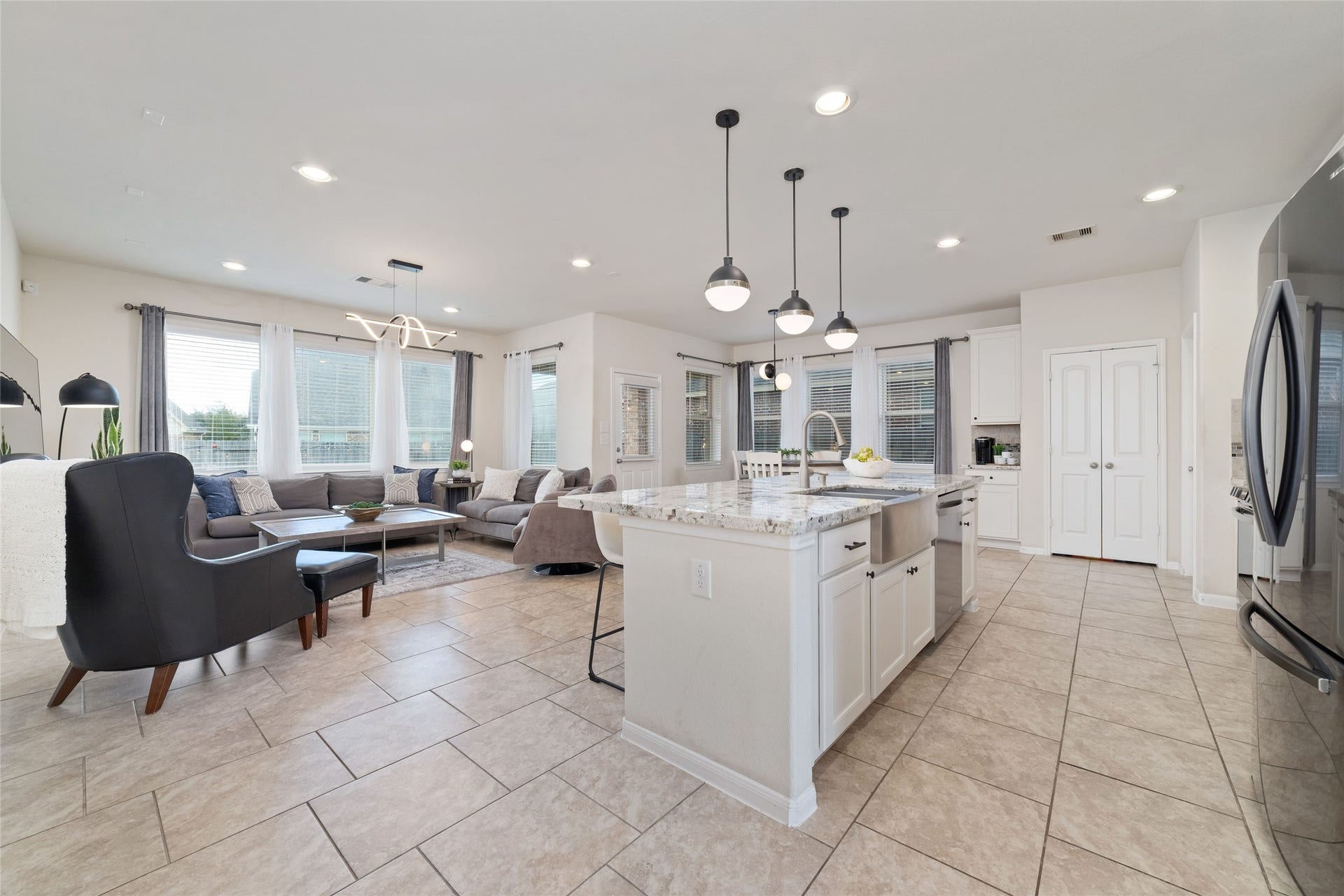 The open concept kitchen, dining and living areas create a bright, spacious layout perfect for everyday living and entertaining.