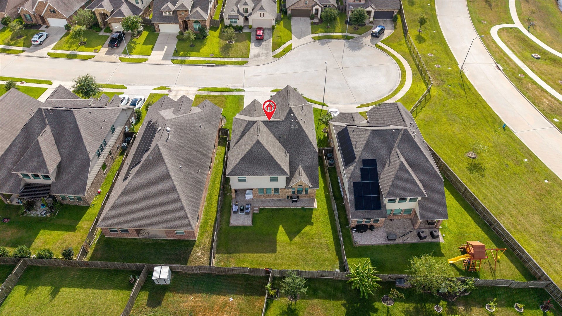 Ariel view showcasing the extended patio and spacious backyard space.