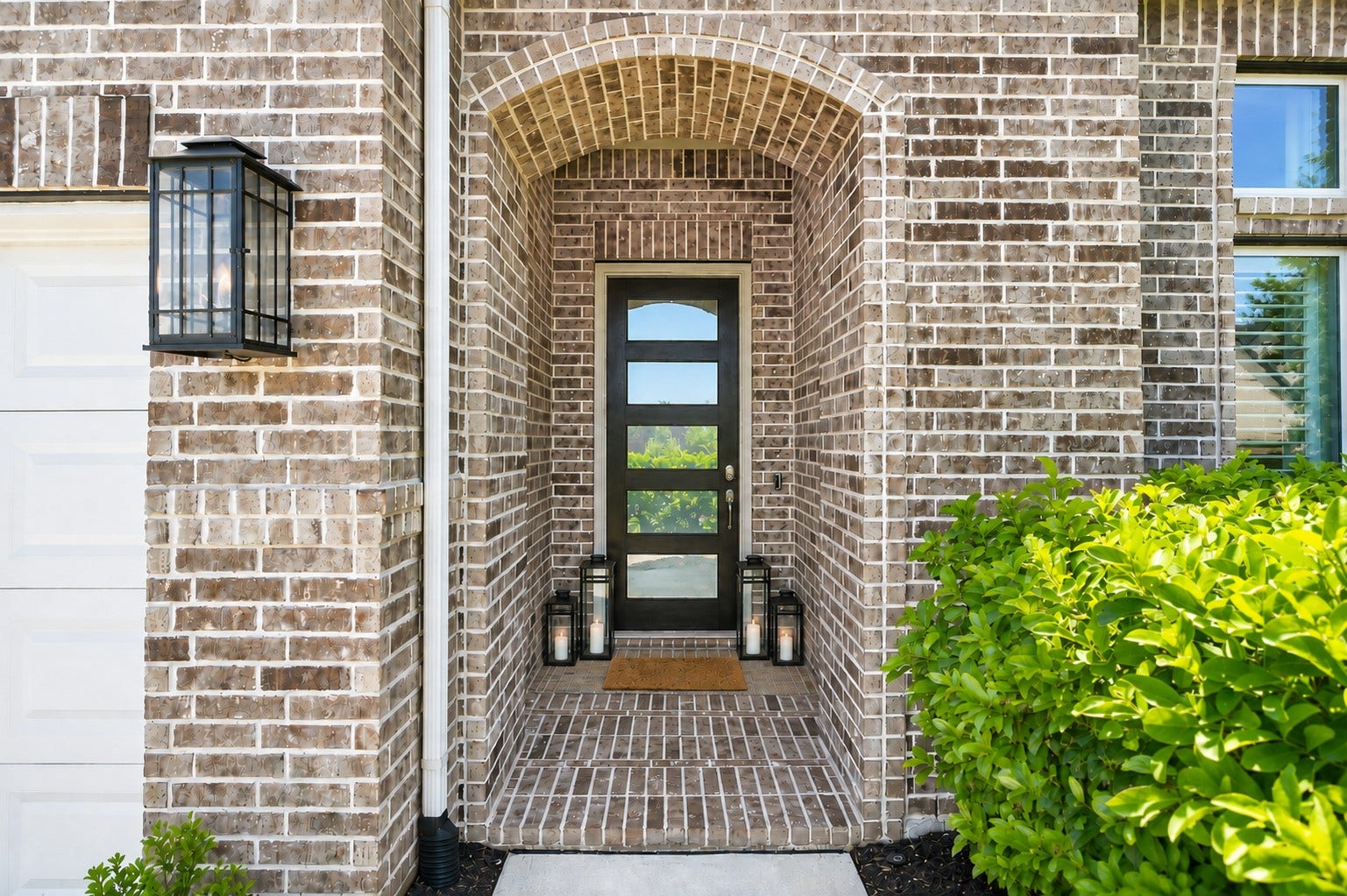 3011 Lantana Trail, Katy, TX 77493 Gas lantern accents the covered entrance to the home.