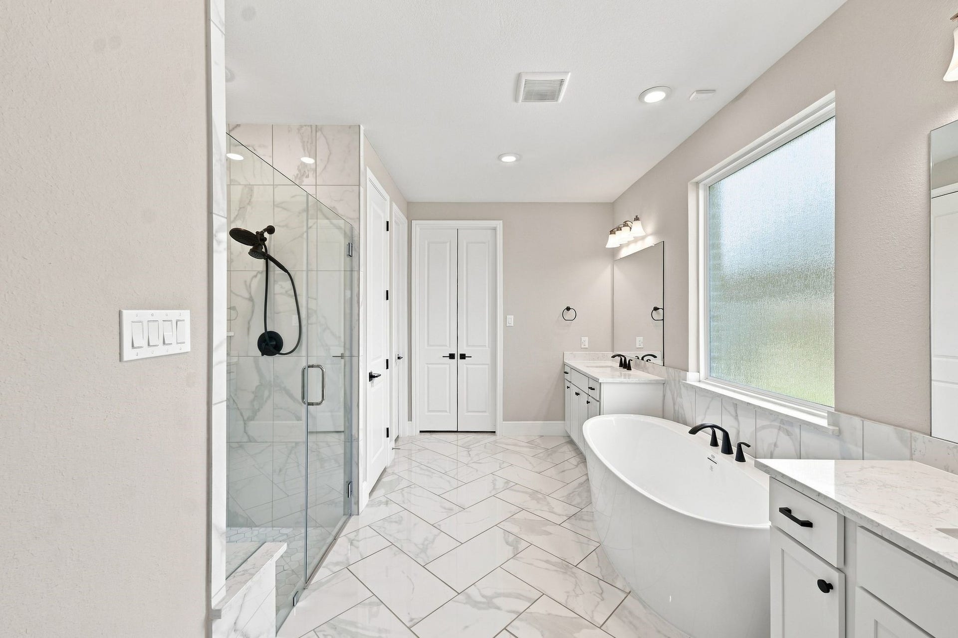 3011 Lantana Trail, Katy, TX 77493 Primary suite bathroom features soaker tub & separate shower, with an oversized closet (accessible through the folding doors), which also connects to the laundry room!