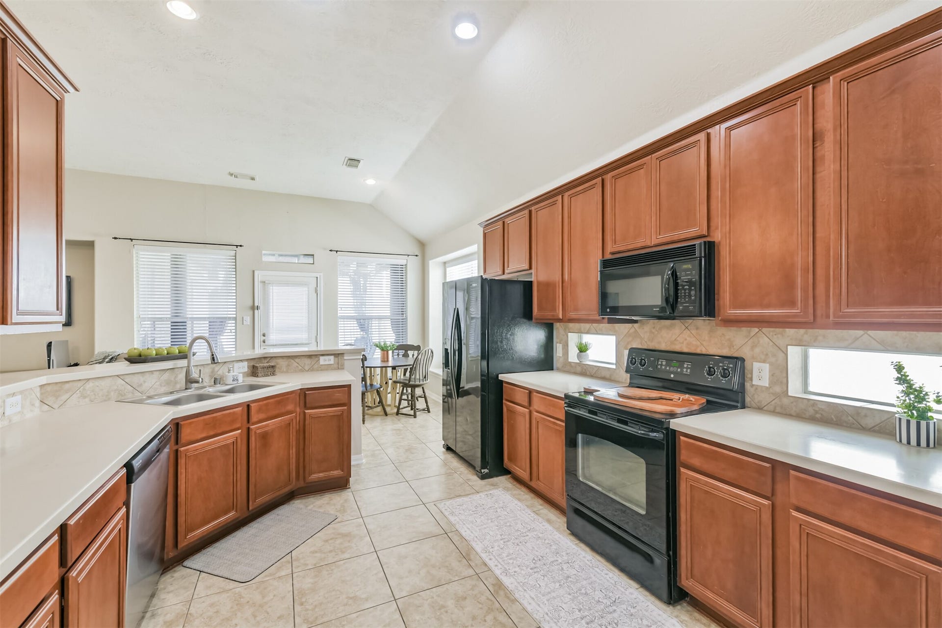 Lots of counterspace and cabinets in your large kitchen.