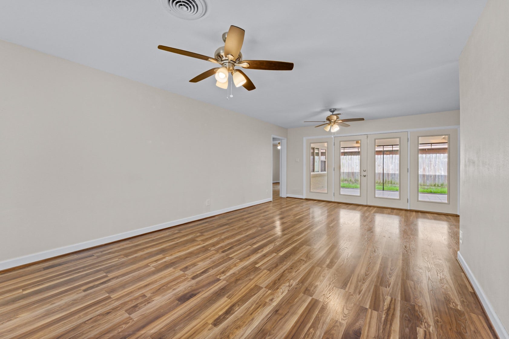 This space makes it easy to experience true indoor/outdoor living. Open the patio doors to the huge covered patio.  Great for entertaining!