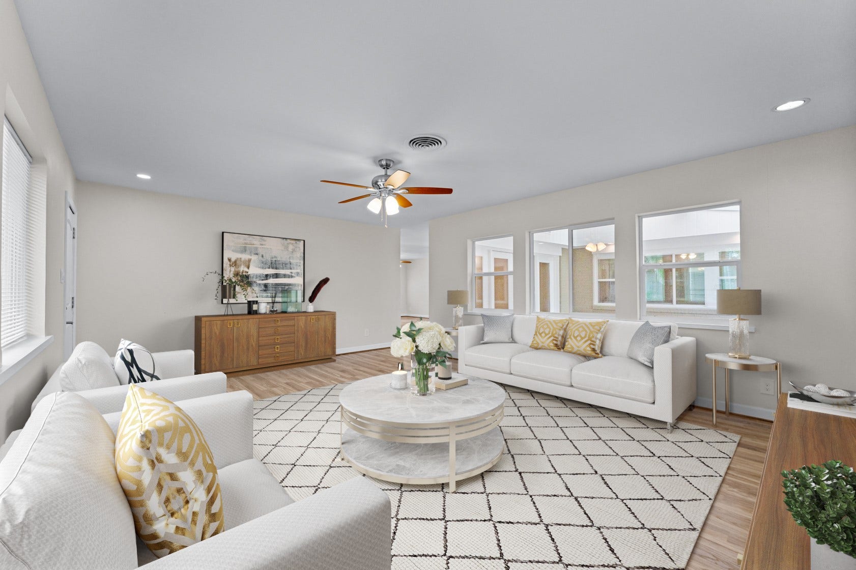 With windows on two sides of this living area, natural light fills the room at various times throughout the day.  Virtually staged photo.