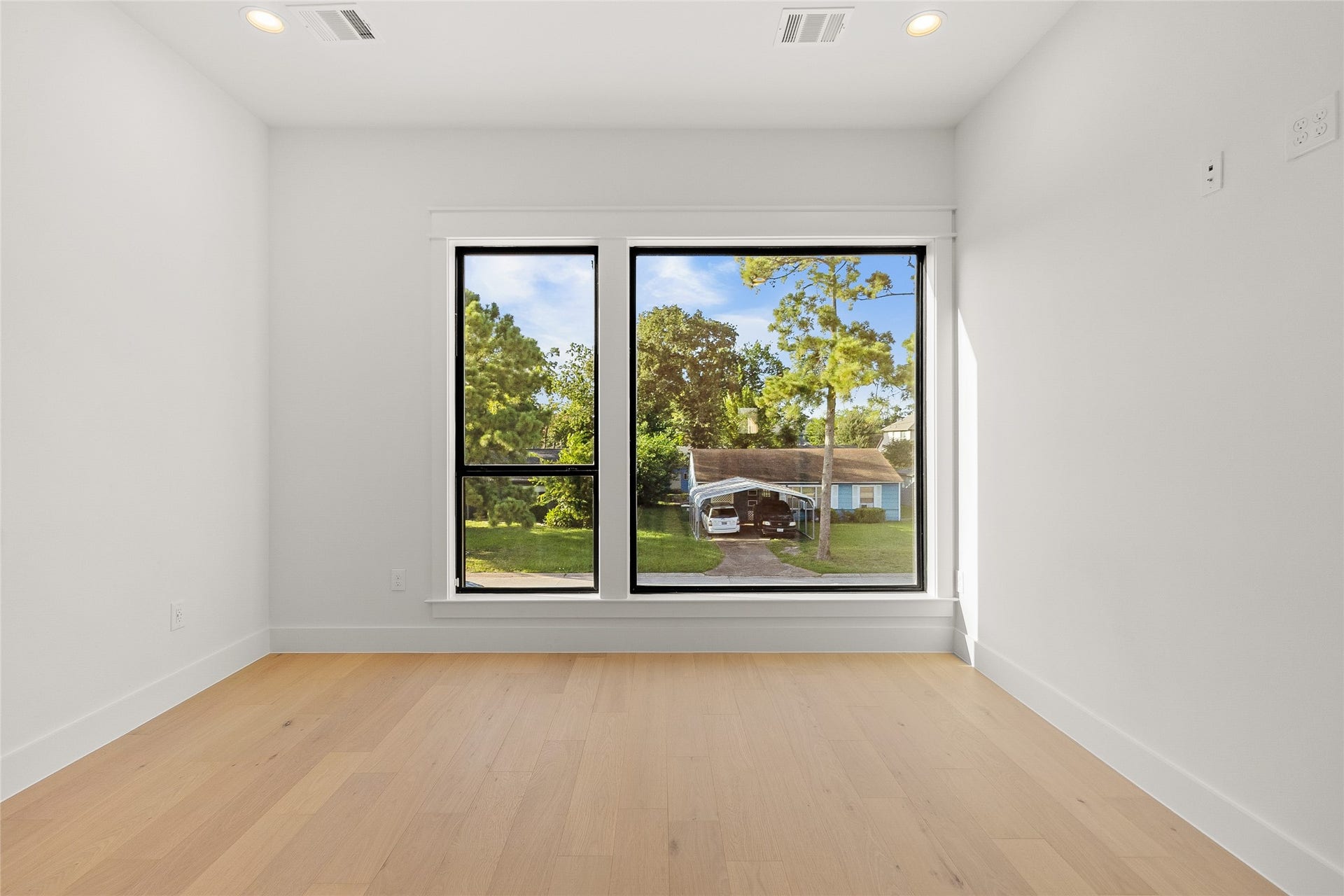 Natural light pours through oversized windows, creating a bright and inviting bedroom you'll look forward to calling your own.