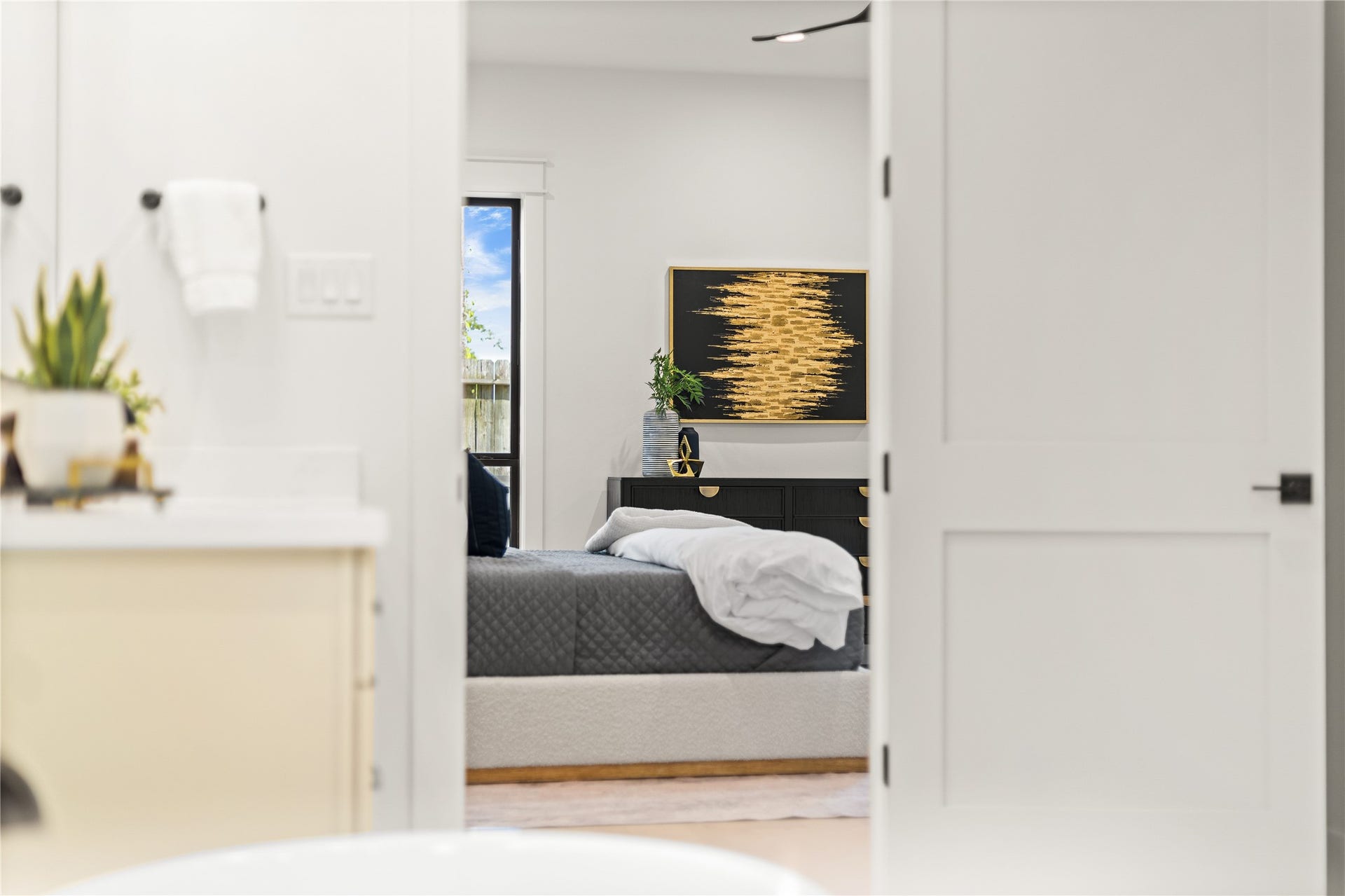 Your luxurious primary suite provides a quiet sanctuary, tucked away from the main living areas for added comfort and privacy.