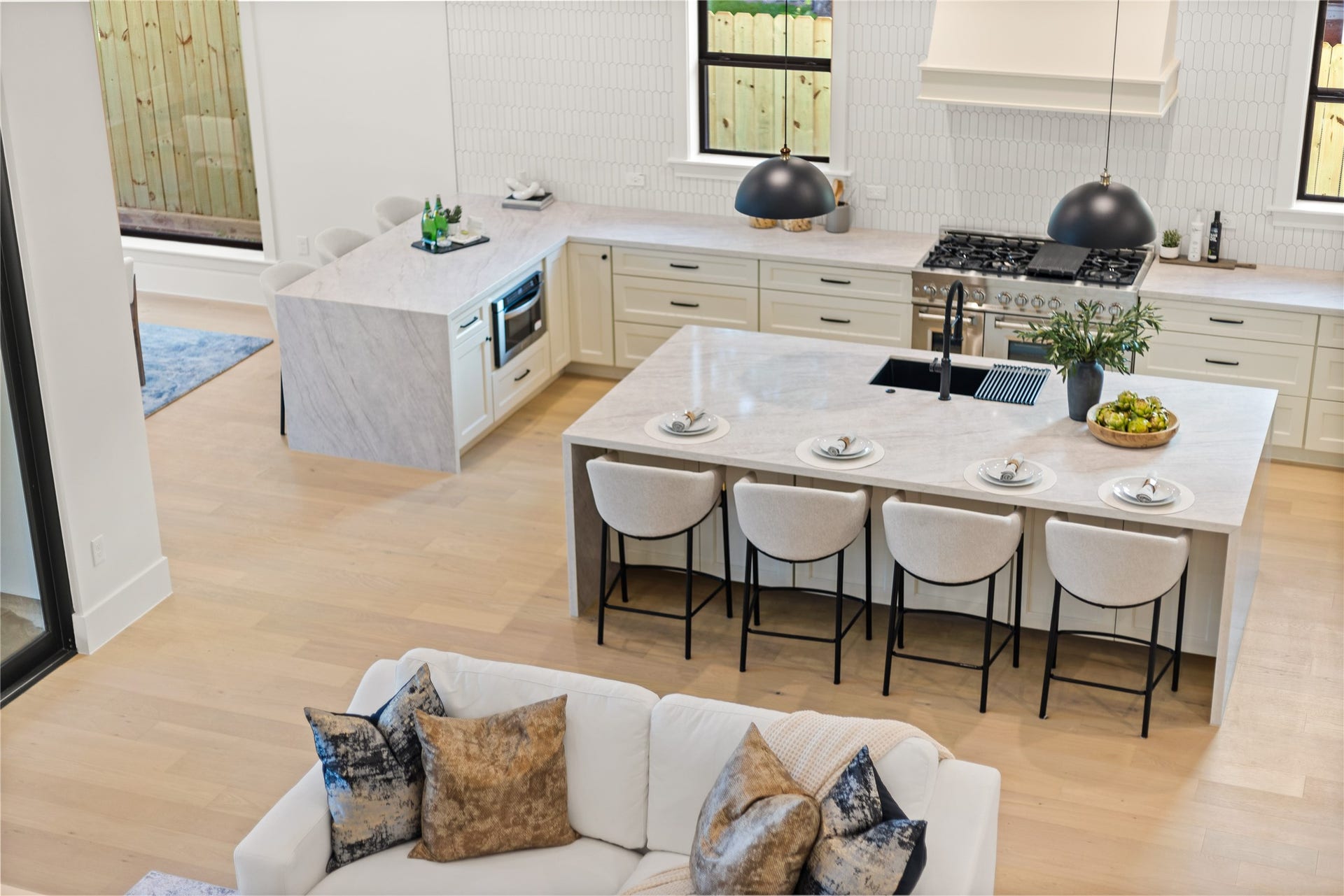 Your chefs kitchen makes every meal feel special with dual waterfall islands, premium appliances, abundant cabinetry, and plenty of space for gathering.