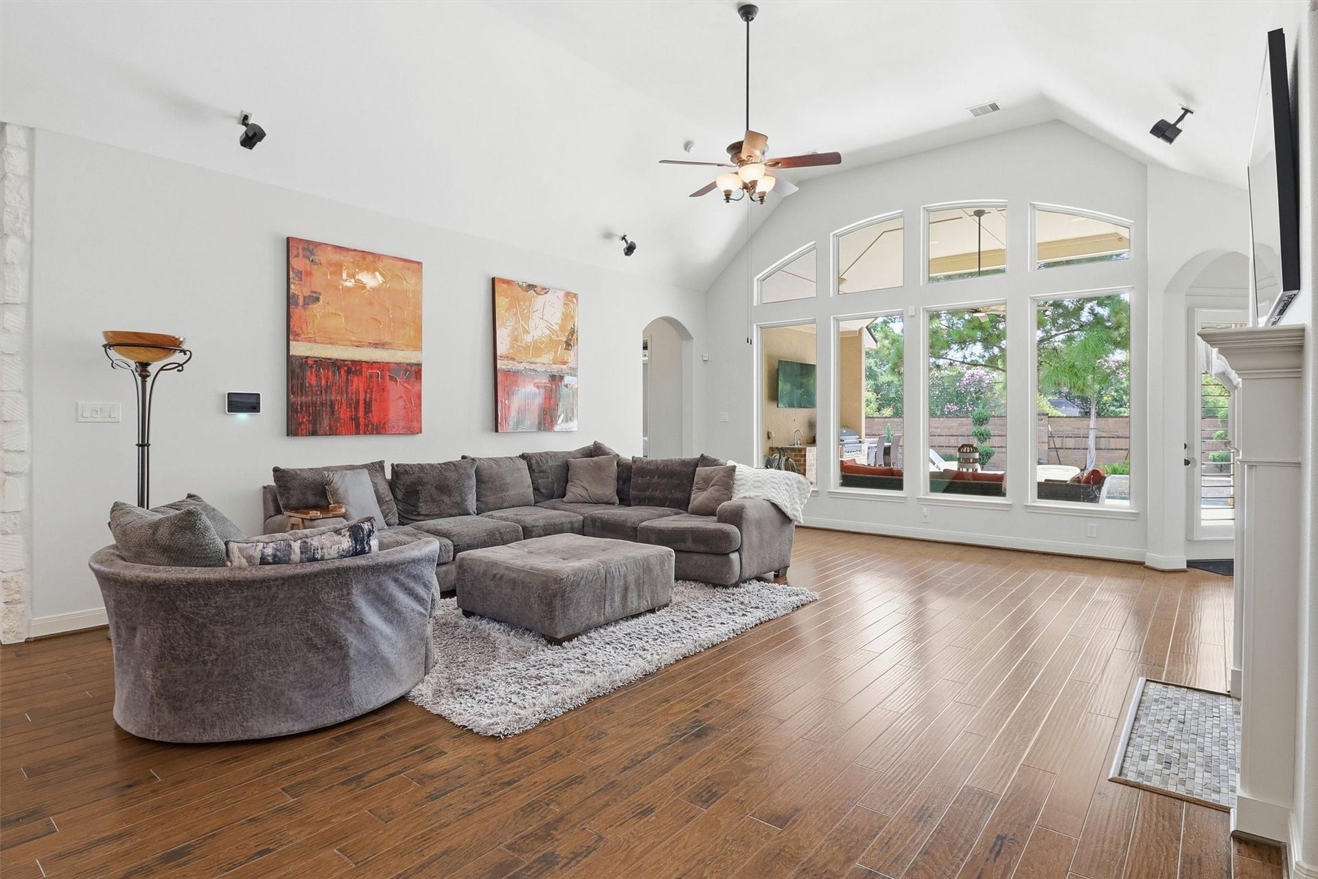 27114 Ashford Sky Lane, Katy, TX 77494 Huge windows bathe the room in light while a vaulted ceilings gives this large living area a lofty, airy feel.