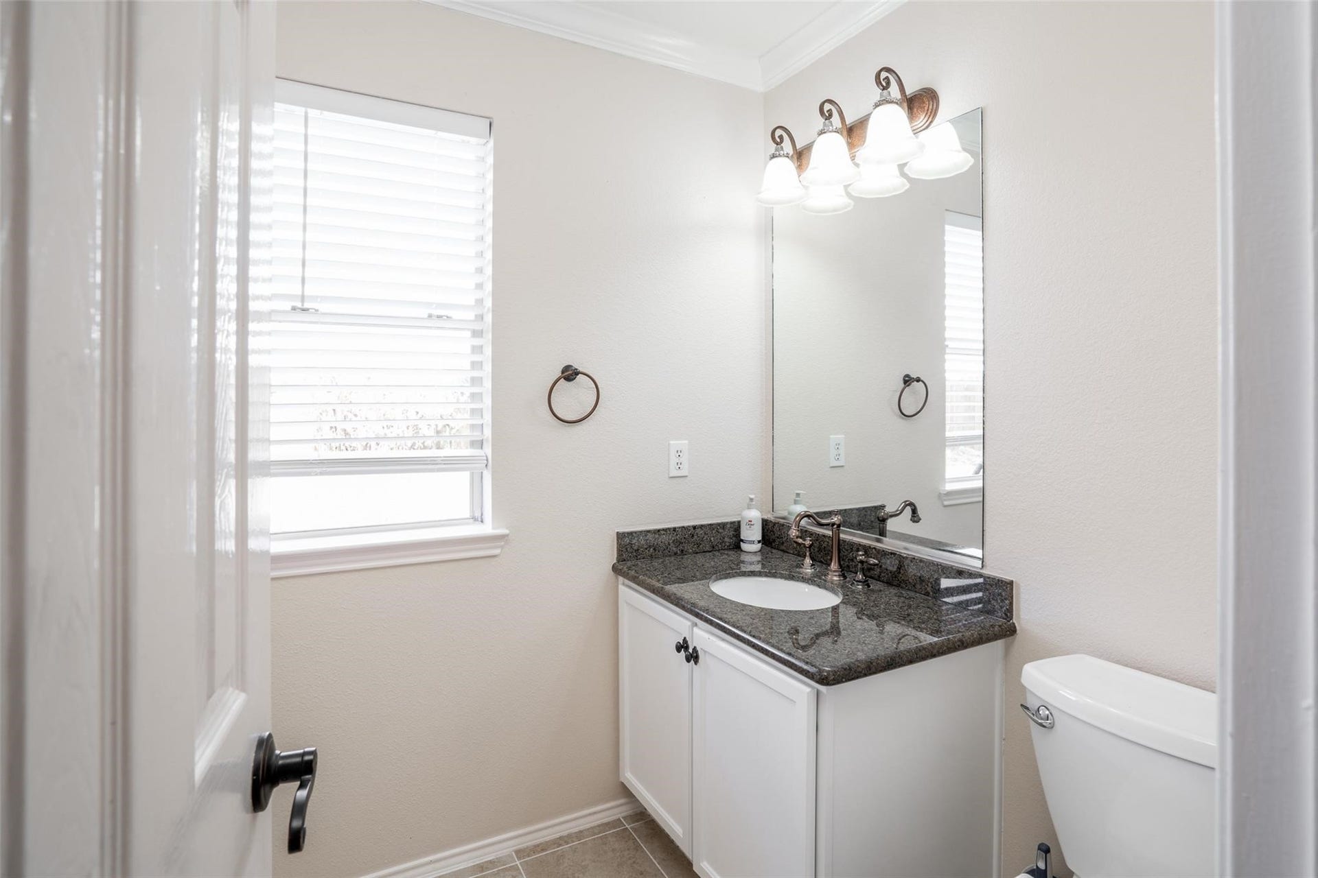 21314 Somerset Park Lane, Katy, TX 77450 A convenient half bath is tucked away at the back of the home!