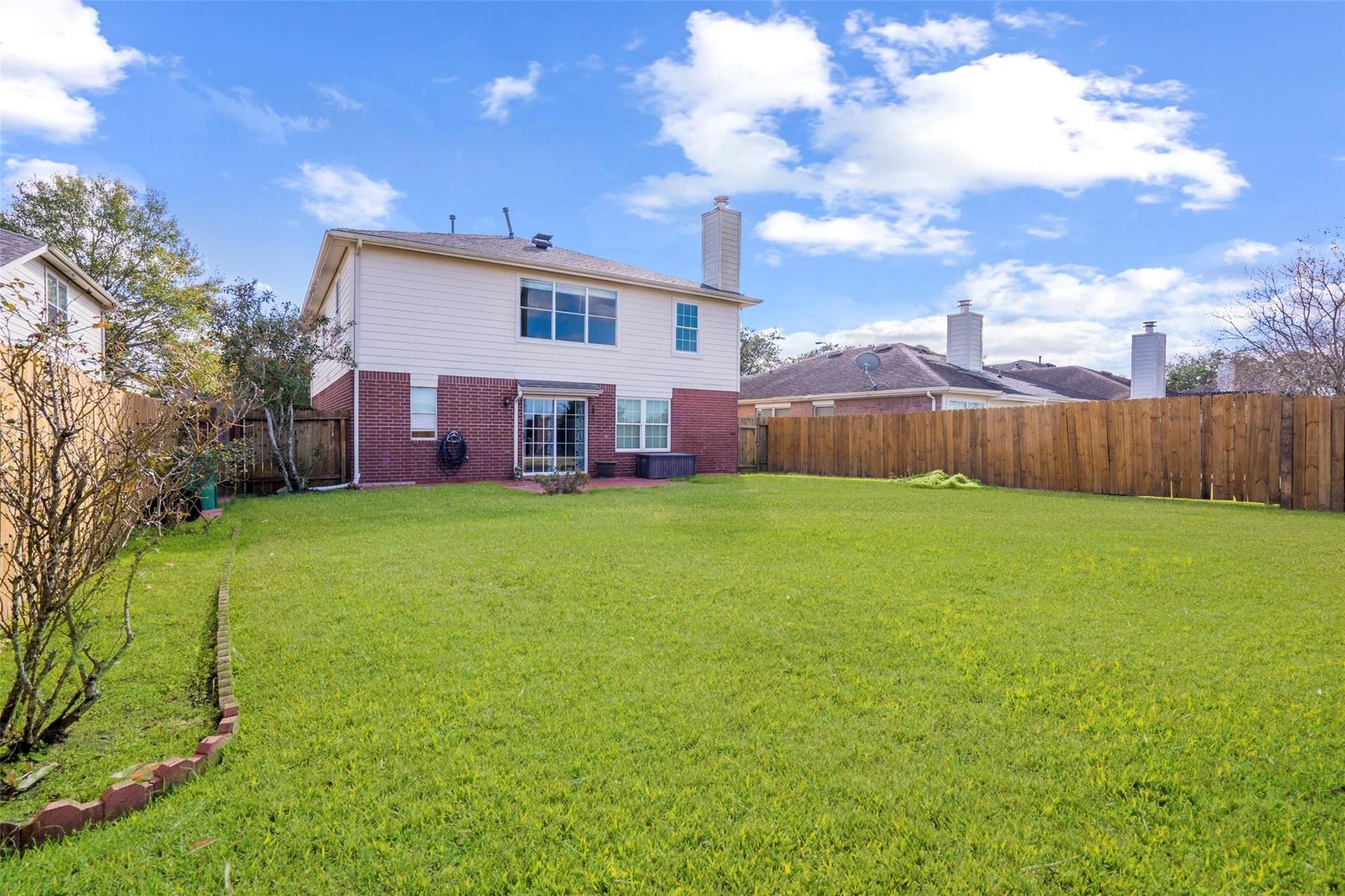 21314 Somerset Park Lane, Katy, TX 77450 They yard is incredibly large with plenty of green space for afternoon fun! *grass virtually staged