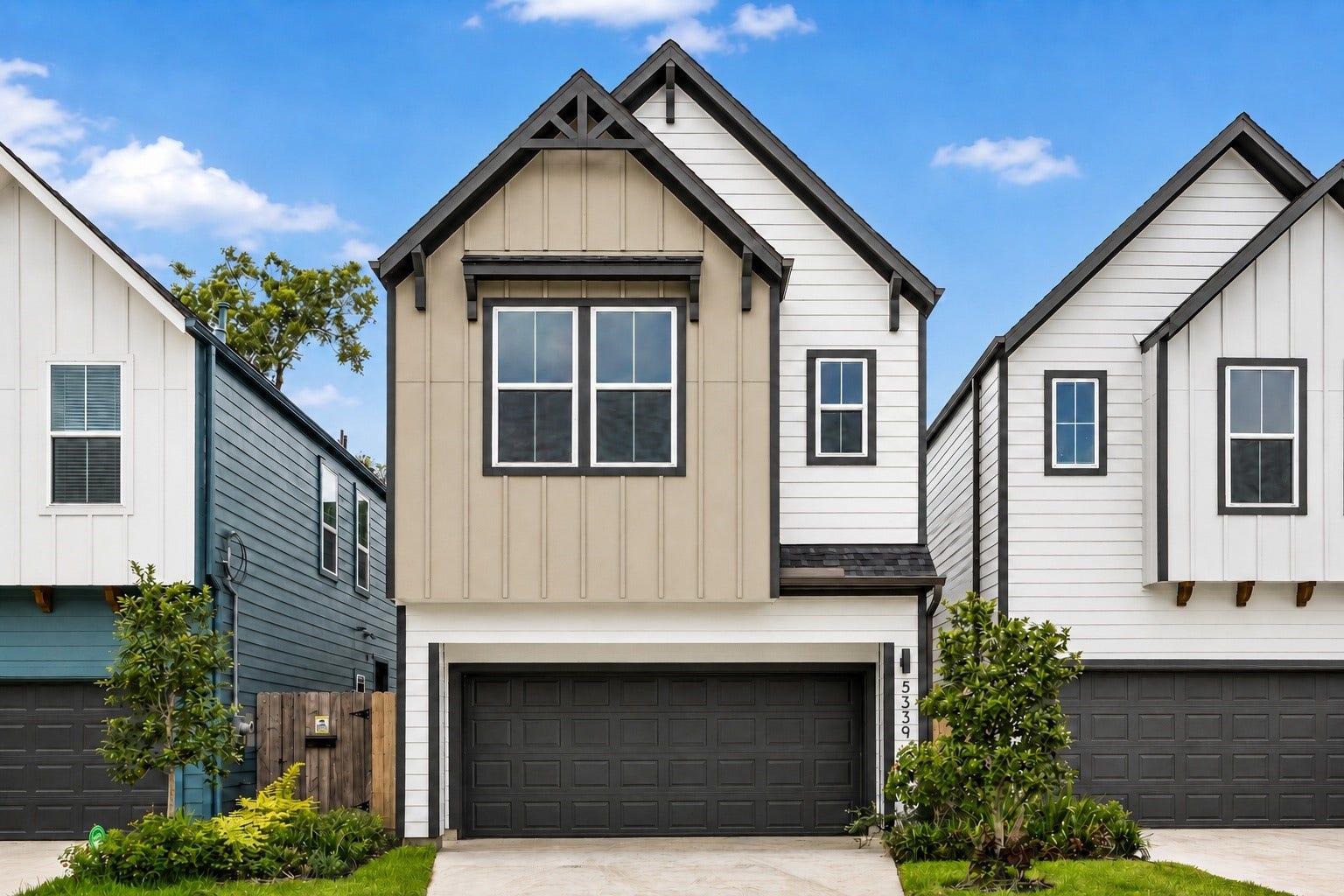 Elegant front elevation wth covered private driveway.