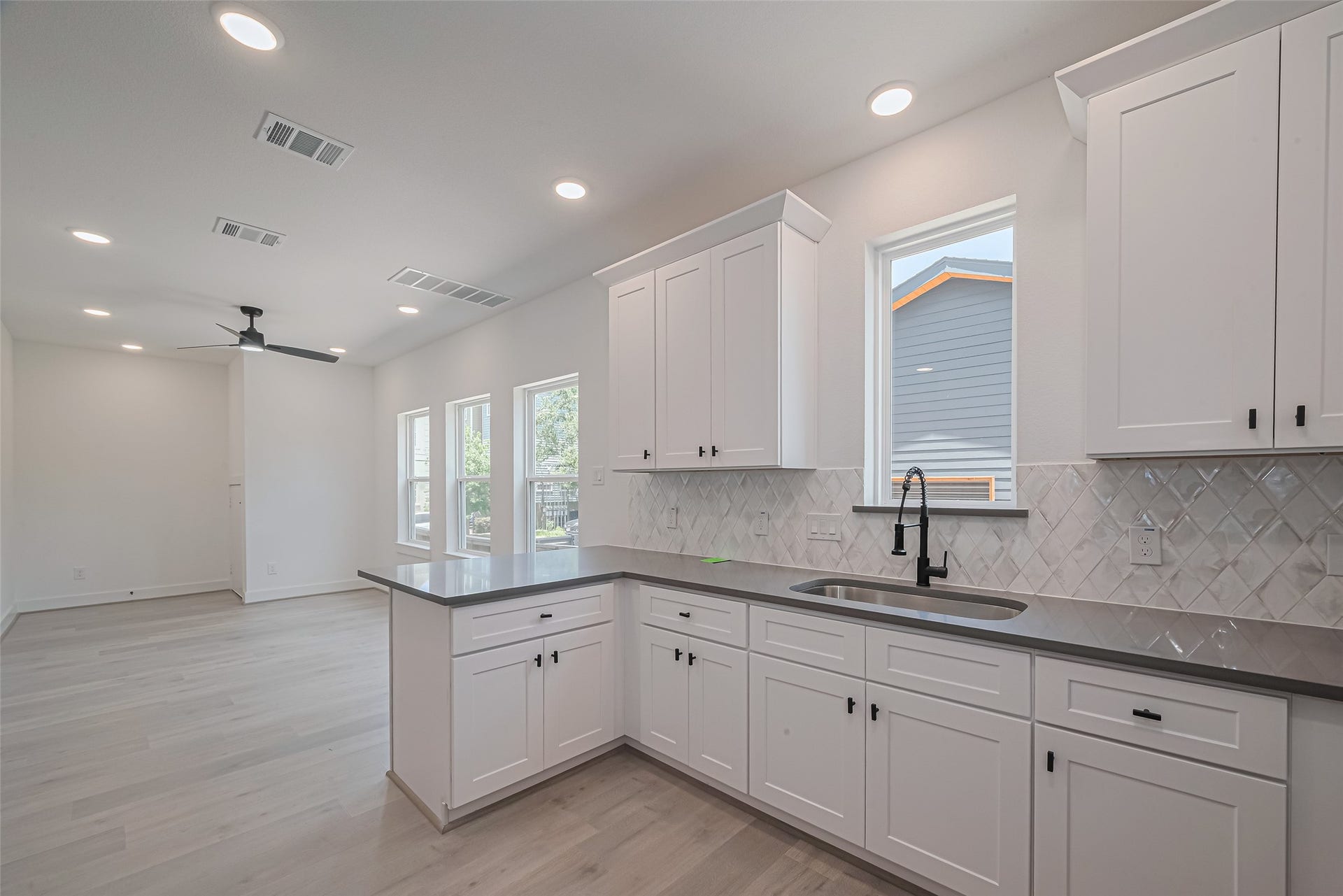 1350 W 24th Street, Houston, TX 77008 Open kitchen with plenty of natural light and a seamless connection to the living area.