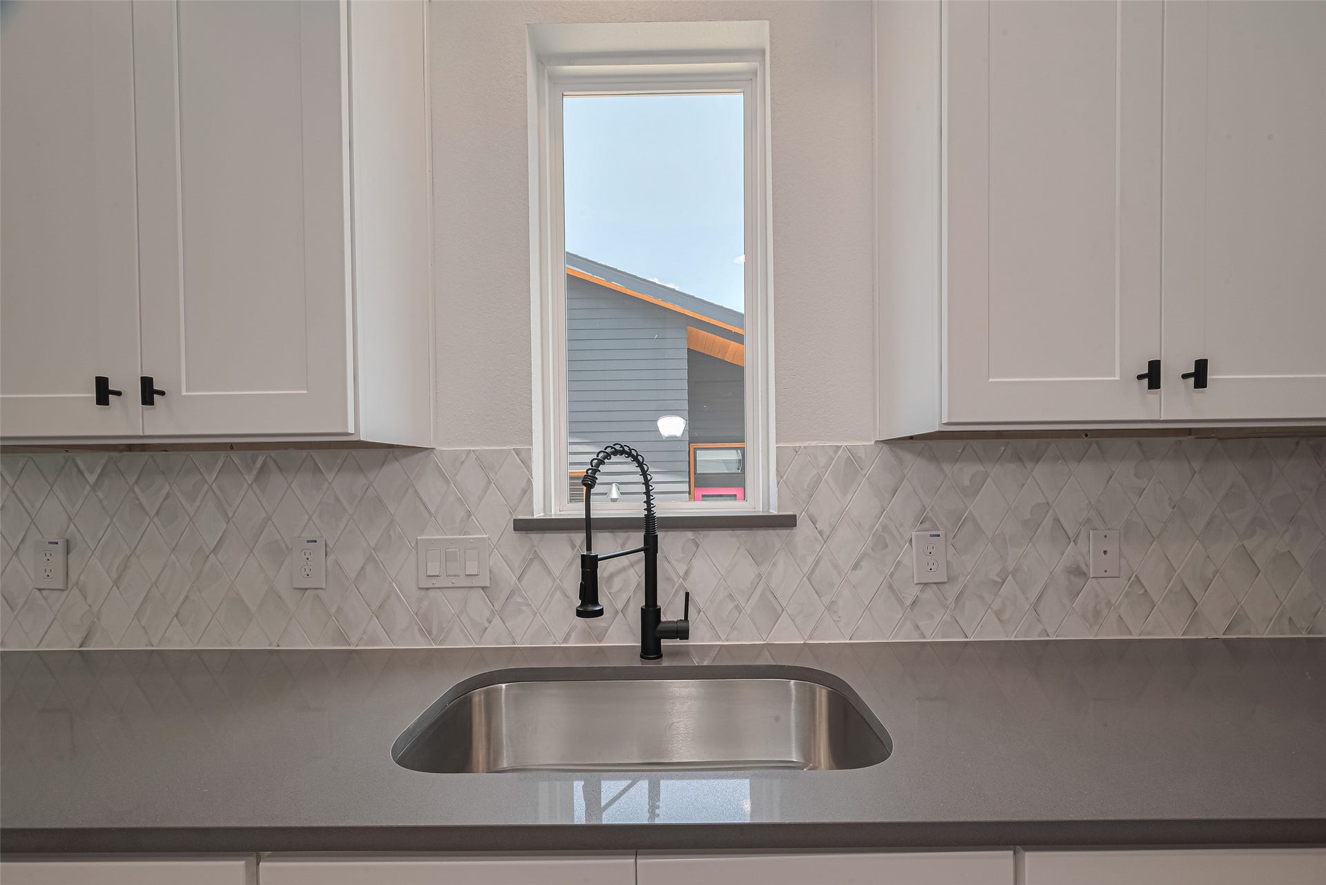 1350 W 24th Street, Houston, TX 77008 Kitchen sink positioned beneath a window, bringing in natural light.