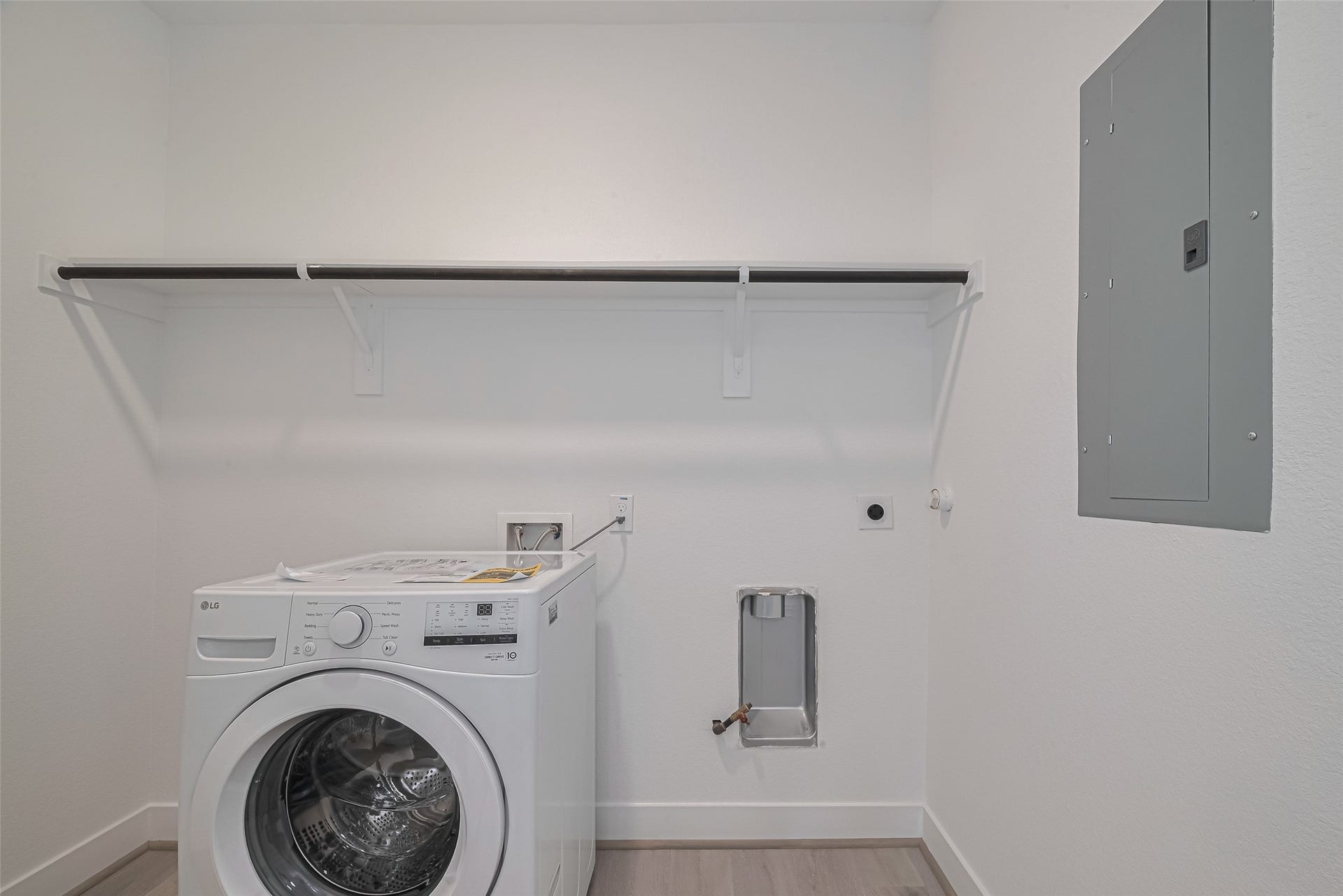 1350 W 24th Street, Houston, TX 77008 Dedicated utility room with overhead shelving for additional storage.