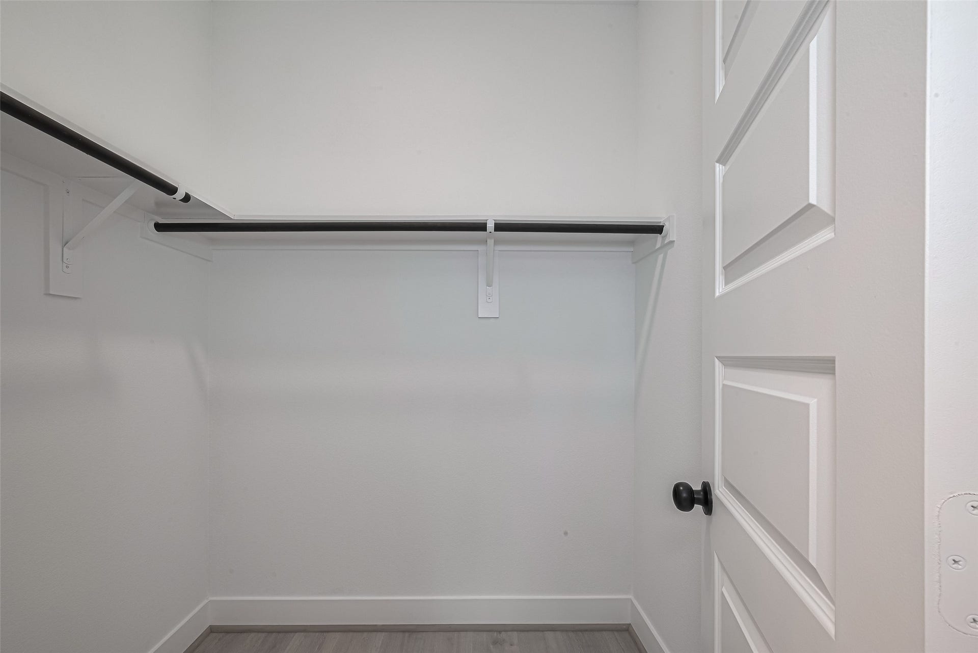 1350 W 24th Street, Houston, TX 77008 Walk-in closet with built-in hanging rods and plenty of storage space.