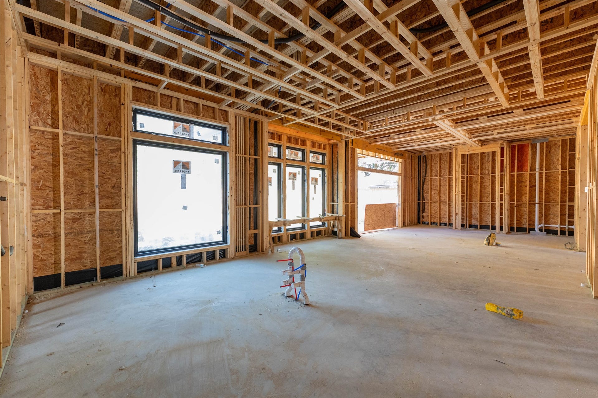 Kitchen, Breakfast & Family Room view from the back. Construction photo taken 10/22/26