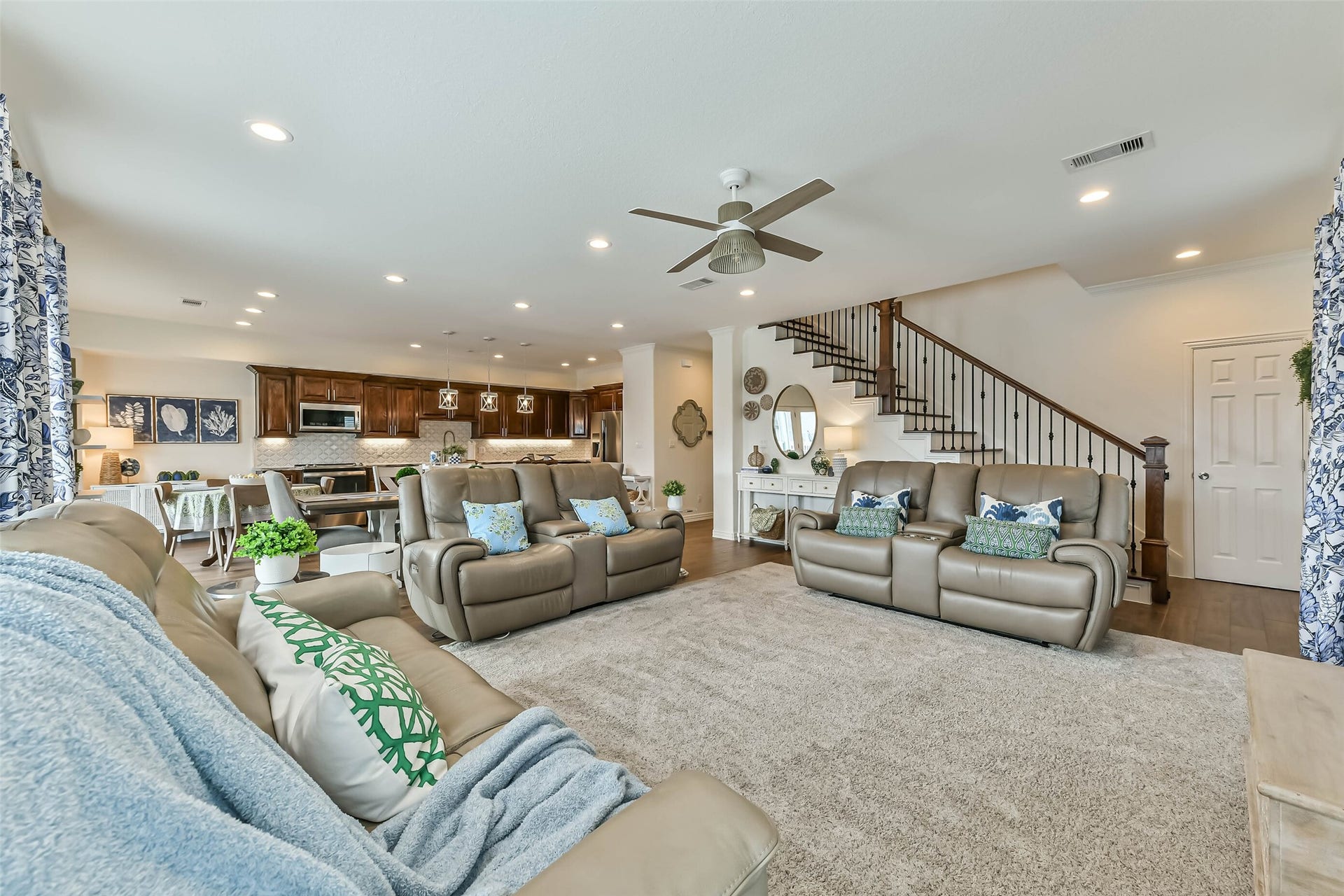 429 Jeanie Lynne Circle, Tiki Island, TX 77554 Bright and spacious living area featuring large windows that frame beautiful canal views while filling the space with natural sunlight.