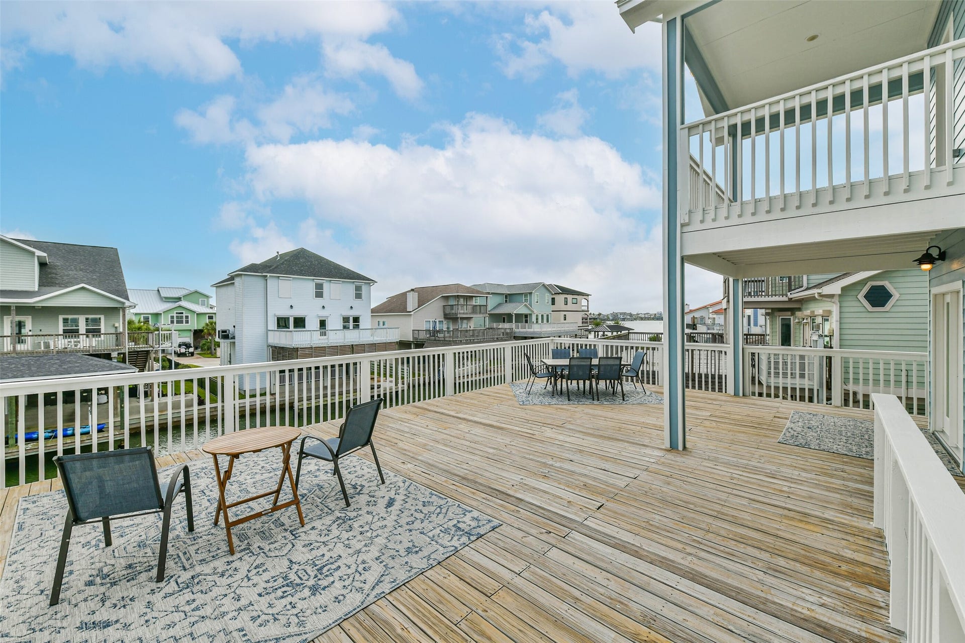 429 Jeanie Lynne Circle, Tiki Island, TX 77554 Spacious outdoor deck offers relaxing canal views and a blend of sun and partial shade, ideal for enjoying coastal breezes and outdoor gatherings.