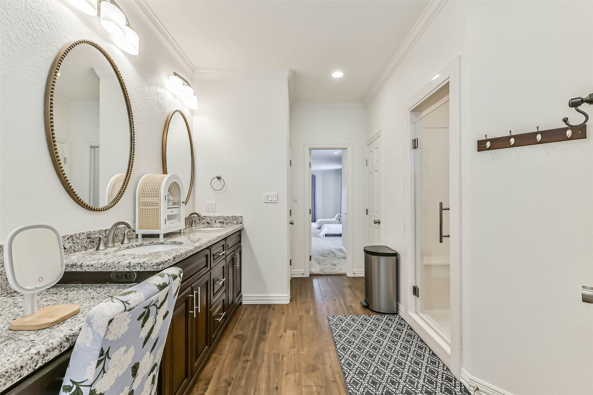 429 Jeanie Lynne Circle, Tiki Island, TX 77554 Inviting bath offers a large walk-in shower, dual sinks, and a functional layout designed for comfort and everyday convenience.