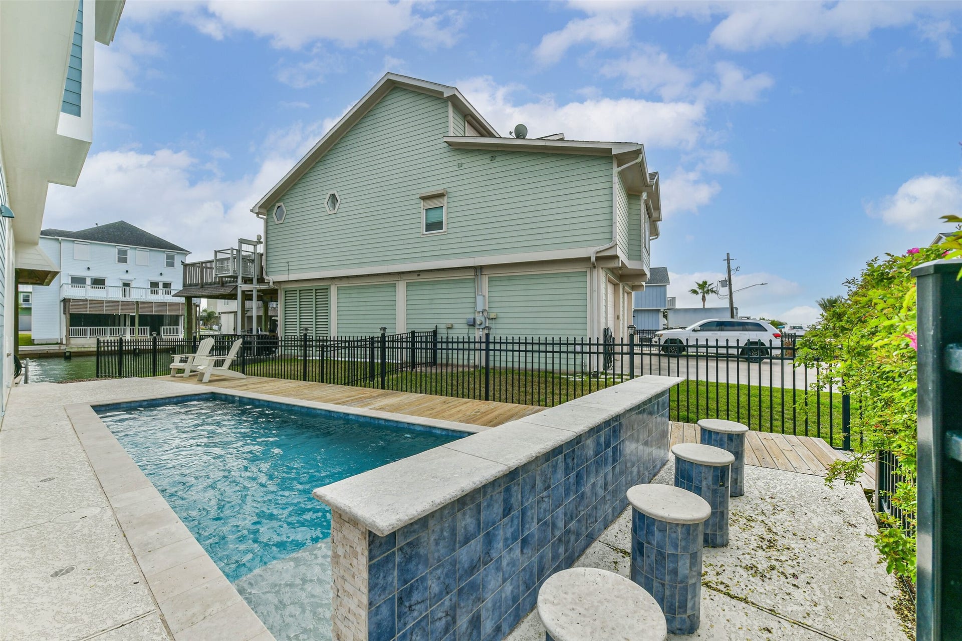 429 Jeanie Lynne Circle, Tiki Island, TX 77554 Thoughtfully designed pool space positioned for privacy and relaxation, blending recreation, entertaining, and coastal lifestyle living.