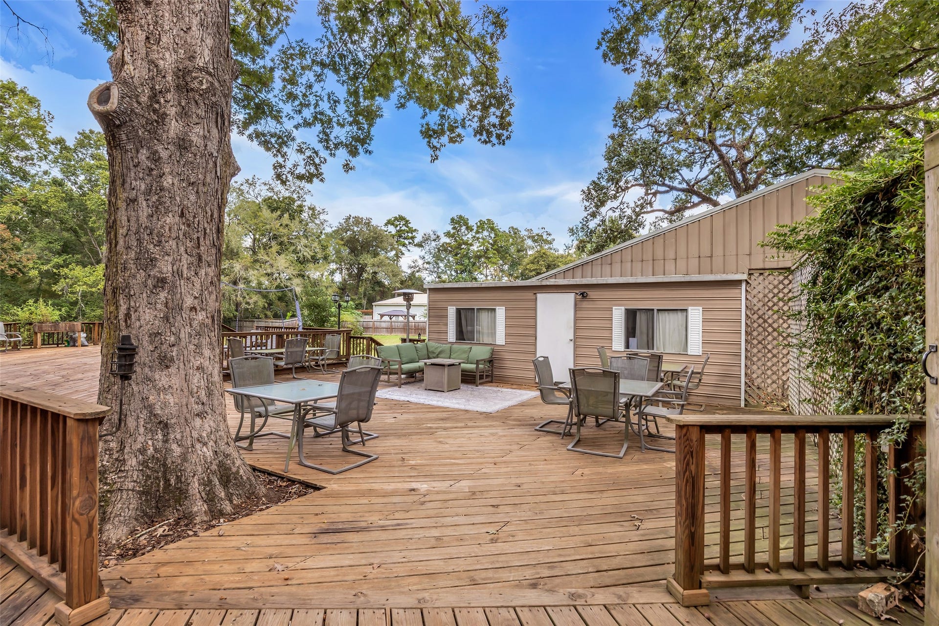 Beautiful deck area with sitting area out side a secondary laundry room
