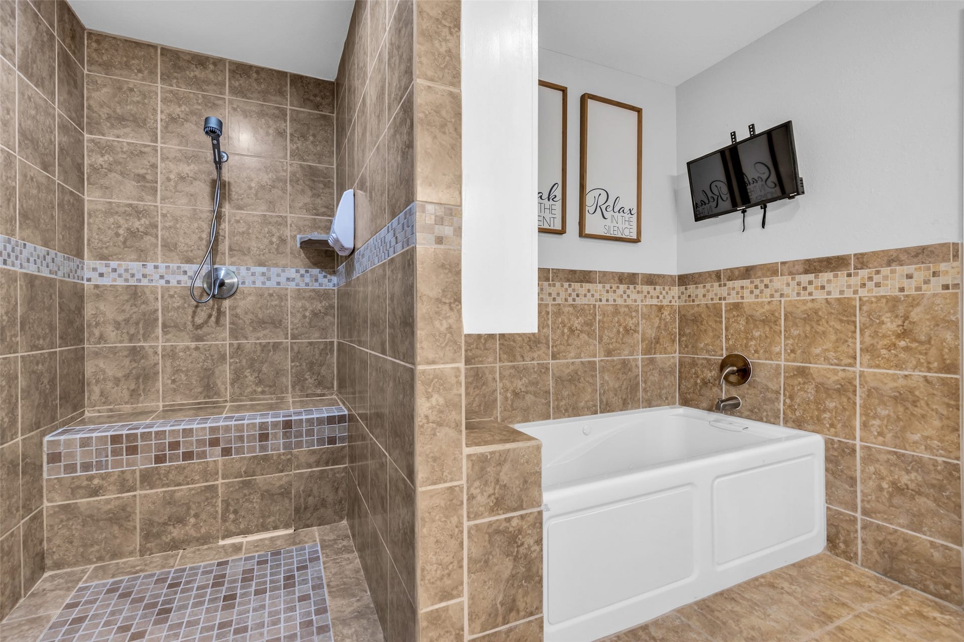 Enjoy the soaking tub or walk in shower in the primary en suite
