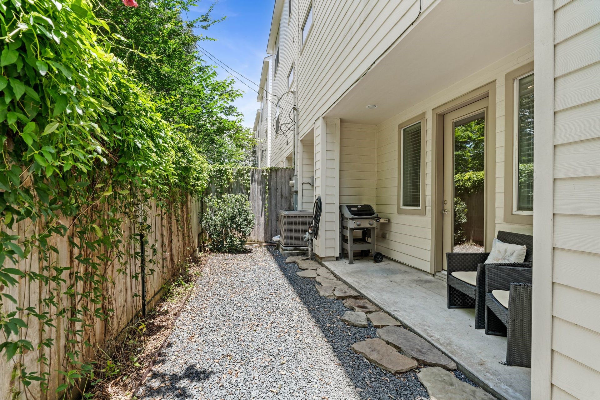Outside, the covered patio and easy-care yard provide just the right amount of outdoor space for grilling or relaxing without the burden of heavy upkeep.