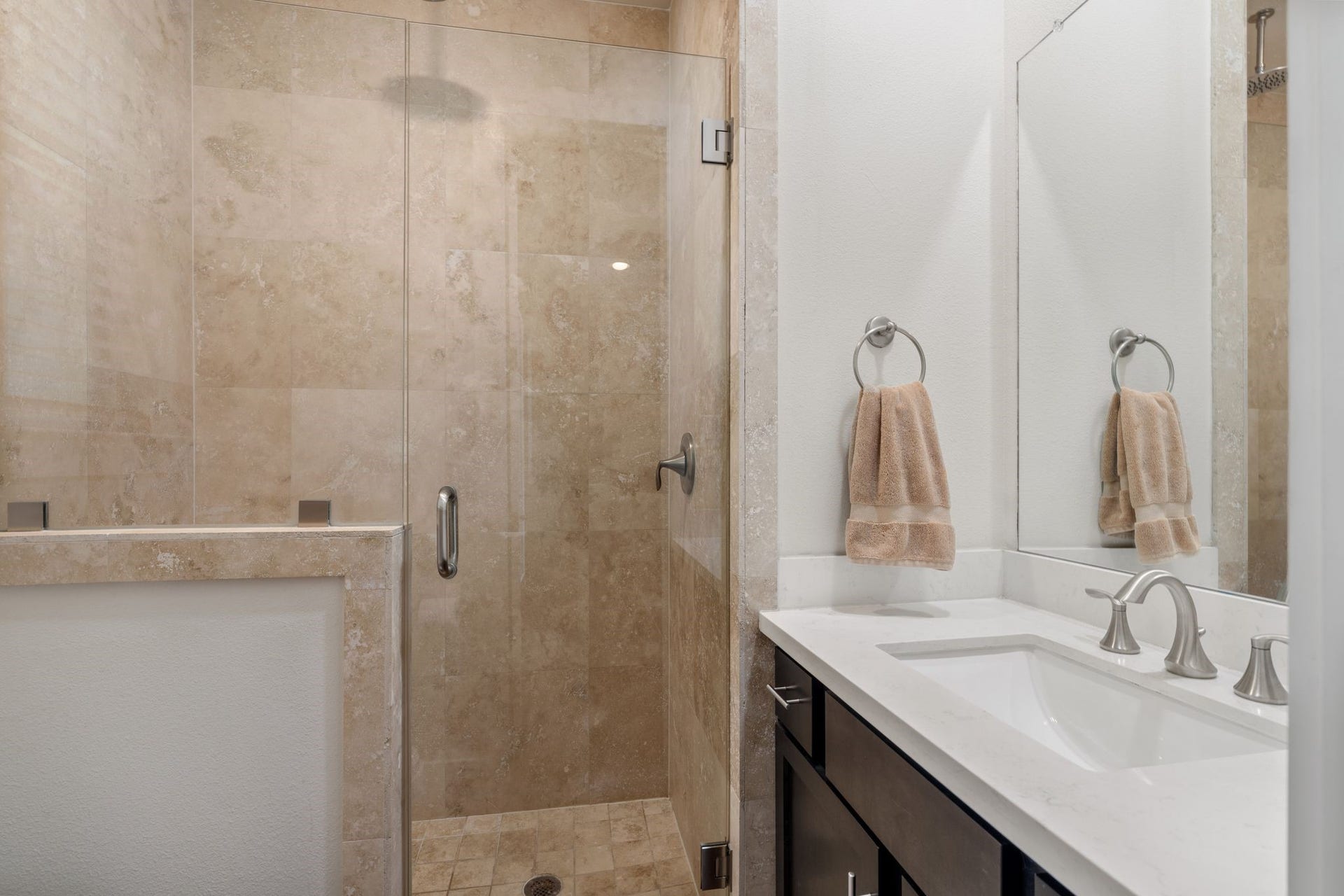This 1st floor suite has a full bathroom with a vanity and walk-in shower.