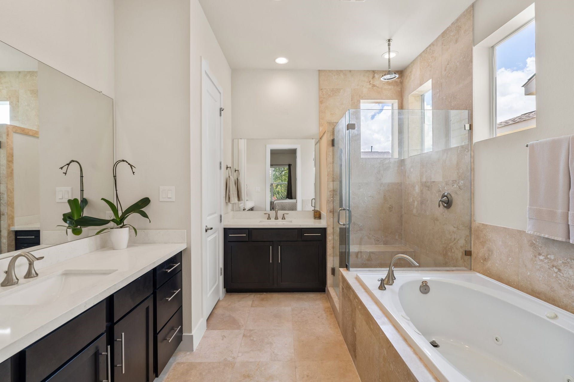 The primary bathroom offers a peaceful escape.