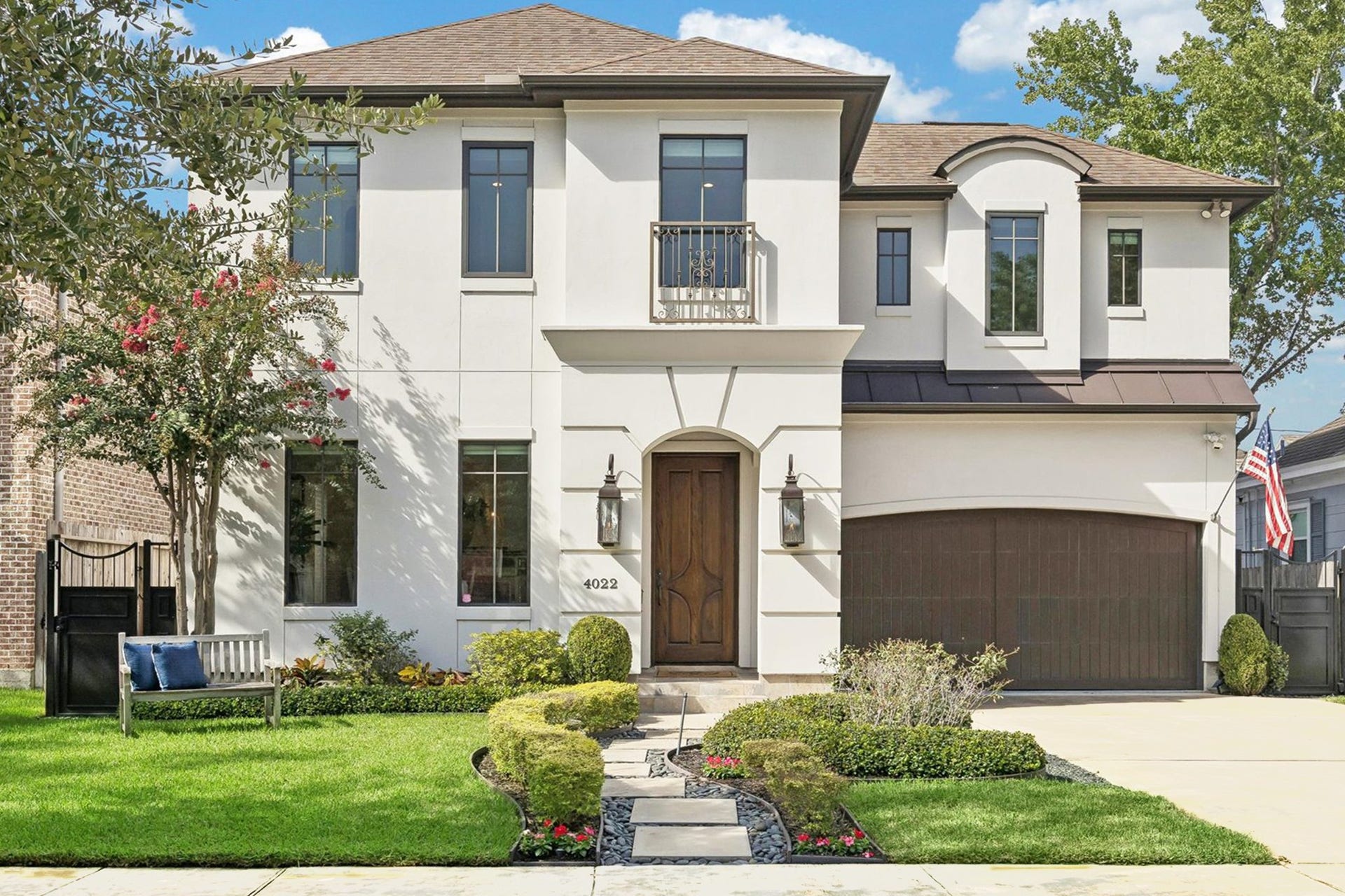 4022 Coleridge Street, West University Place, TX 77005 Welcome home to this elegant two-story stucco residence with timeless architectural details, featuring a welcoming arched entry, custom wood front door, Juliet balcony with wrought-iron railing, and manicured landscaping. The homes refined faade, warm exterior lighting, and thoughtfully designed walkway create exceptional curb appeal in this desirable neighborhood.