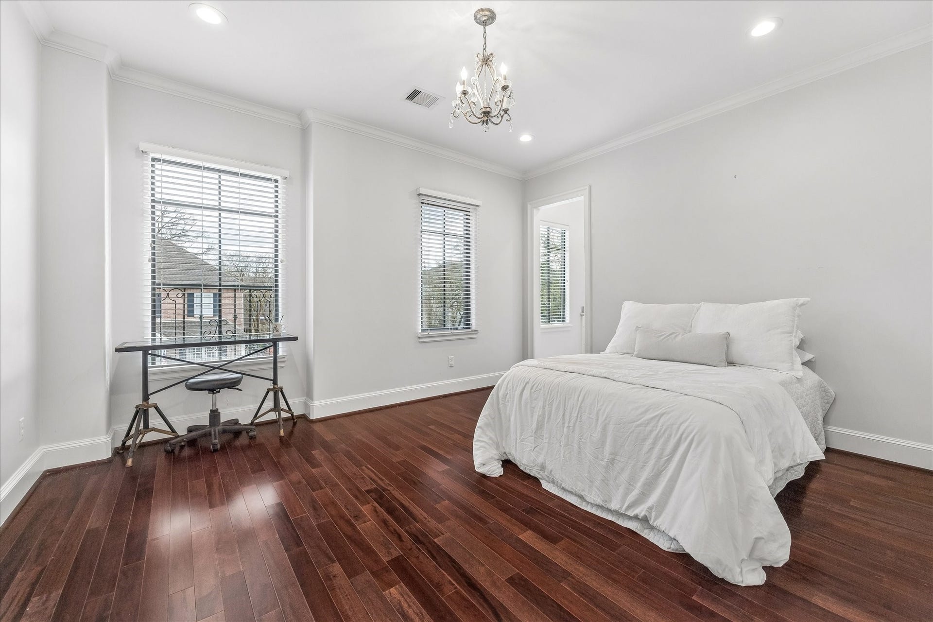 4022 Coleridge Street, West University Place, TX 77005 One of three spacious bedrooms with crown moulding, hardwood floors, and soft natural light.