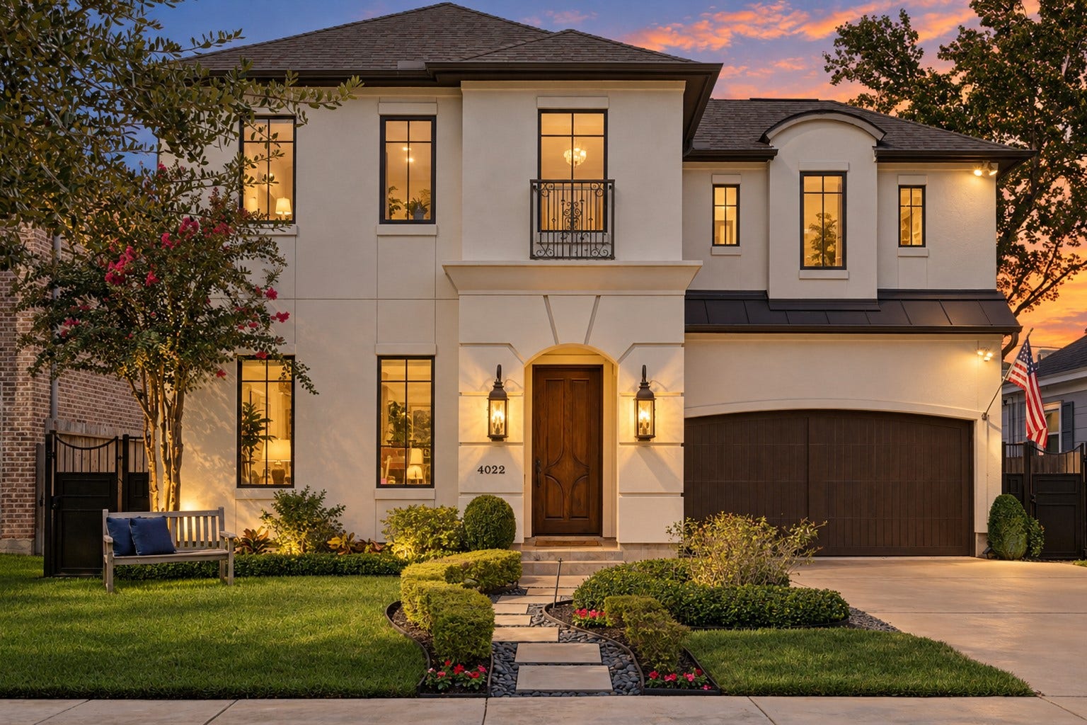 4022 Coleridge Street, West University Place, TX 77005 Digitally enhanced to depict evening conditions, this elegant two-story stucco residence features timeless architectural details including a welcoming arched entry, custom wood front door, Juliet balcony with wrought-iron railing, and manicured landscaping. Warm exterior lighting accentuates the homes refined faade and thoughtfully designed walkway, creating an inviting evening presence and exceptional curb appeal in this desirable neighborhood.