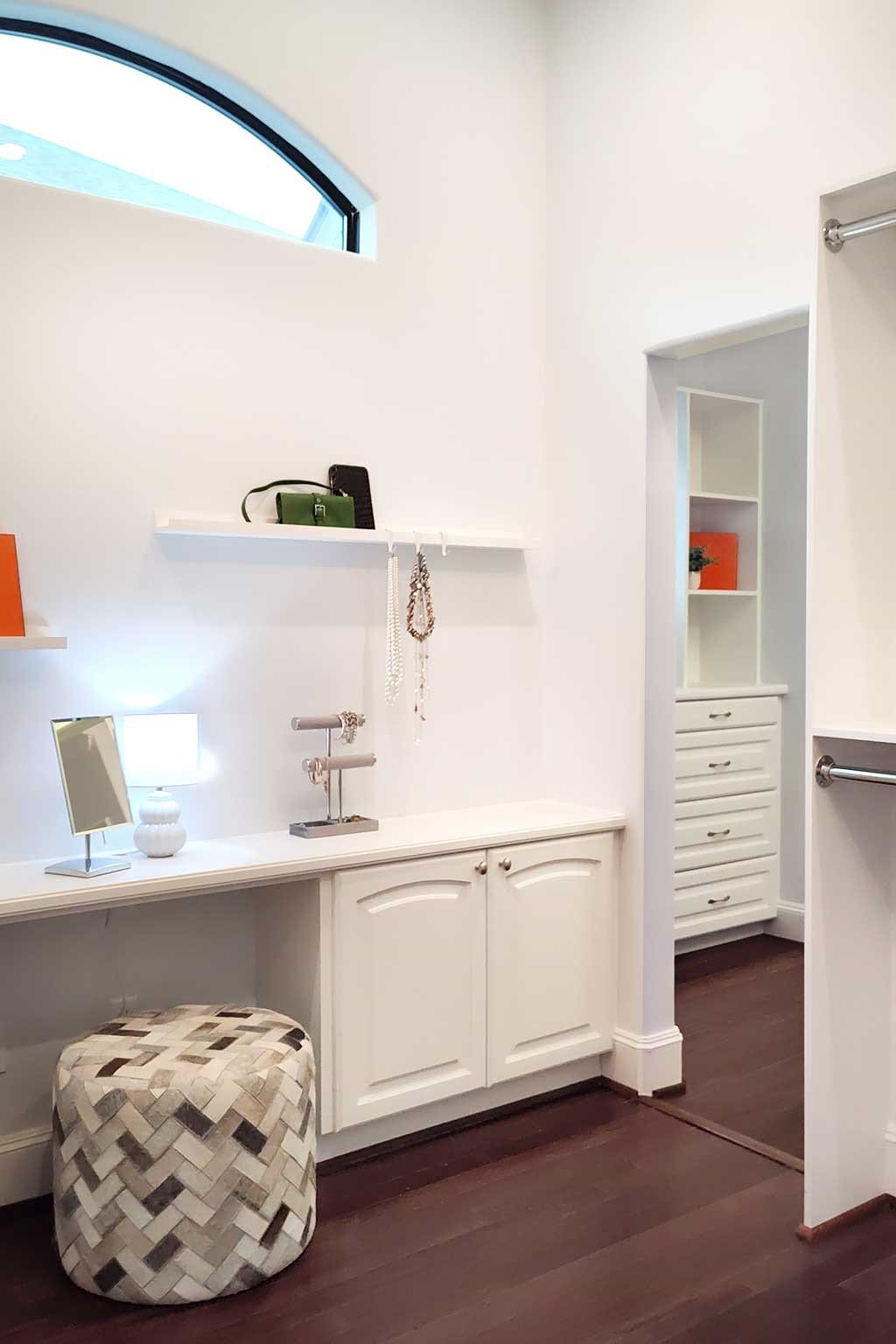 4022 Coleridge Street, West University Place, TX 77005 Another view of the spacious walk-in closet, showcasing its fantastic cabinet and drawer storage along with abundant natural light from the transom windows.
