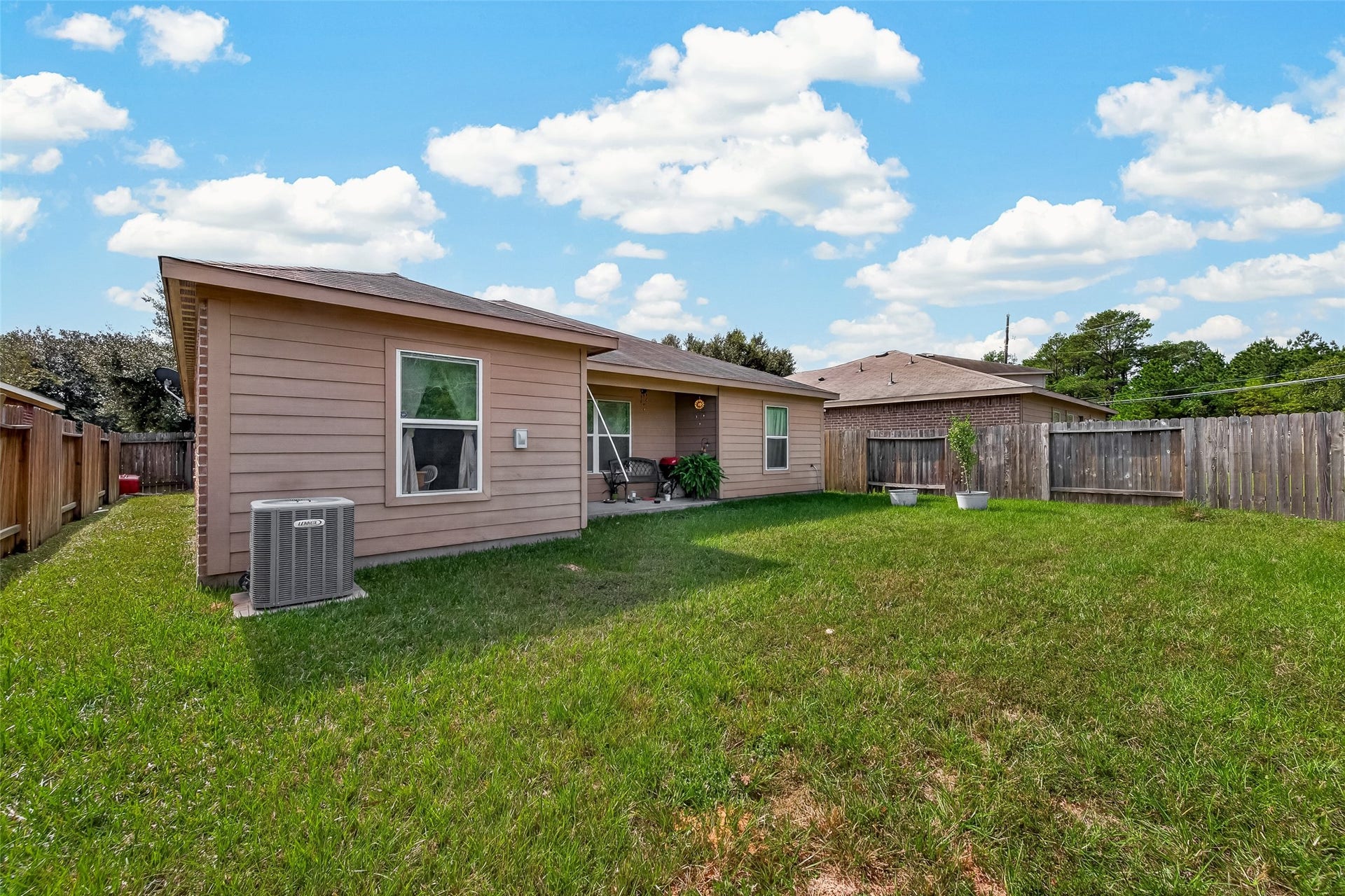 11722 Elizabeth Court, Pinehurst, TX 77362 Spacious yard with covered patio.