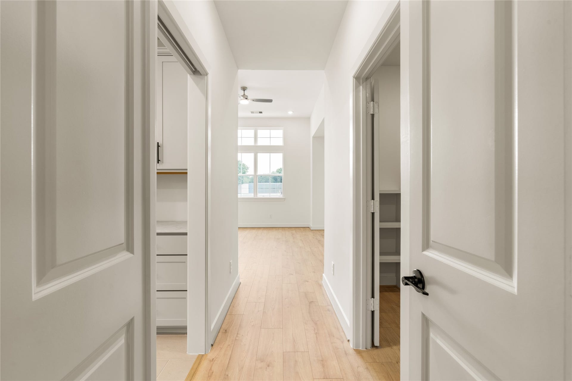 5016 Schuler Street, Houston, TX 77007 Primary suite private hallway direct door access connecting the bedroom suite, laundry area, and walk-in closet.