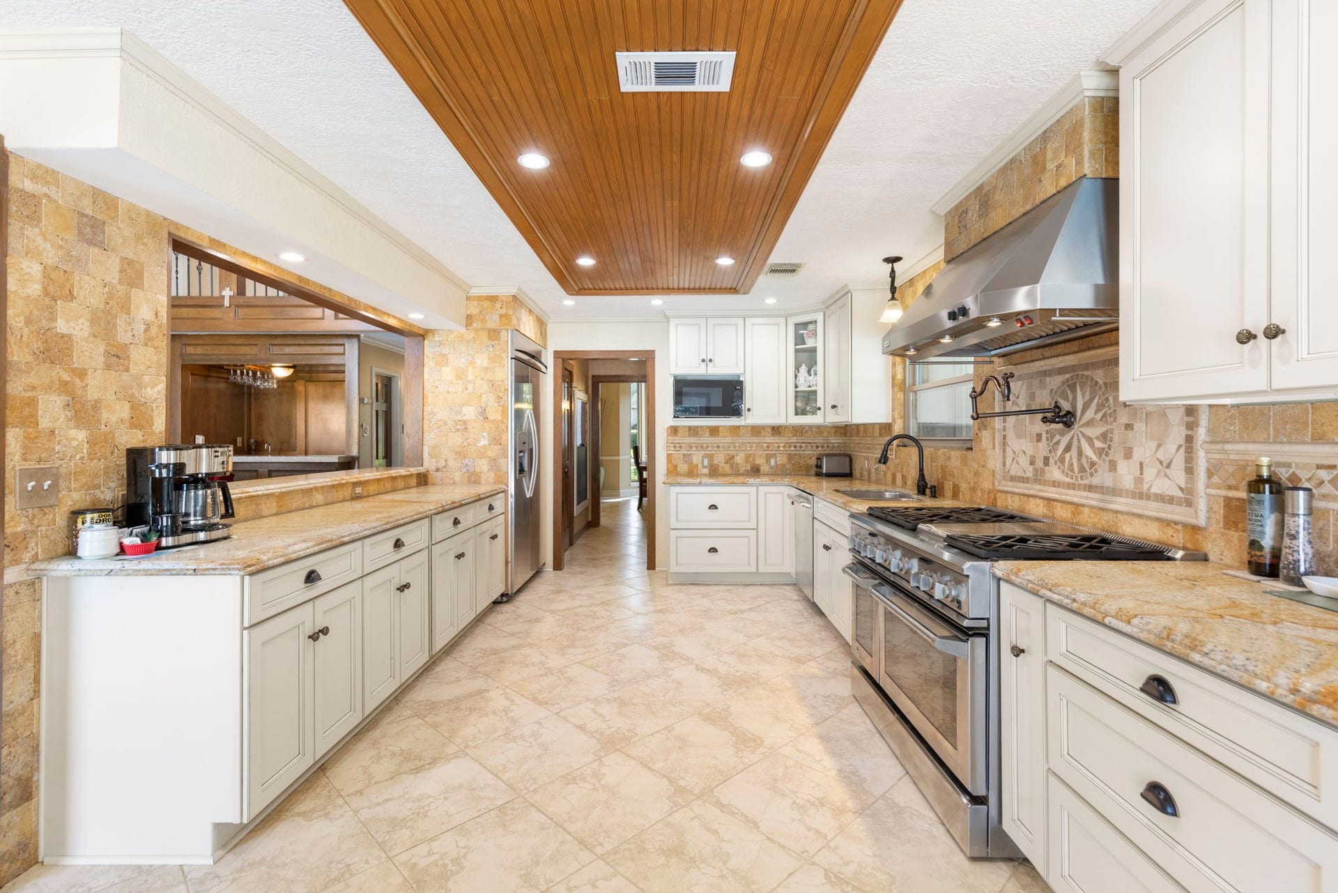 8202 Forest Ridge Road, Spring, TX 77379 The kitchen provides access to the formal dining room, huge utility room, 2-story den and backyard access.