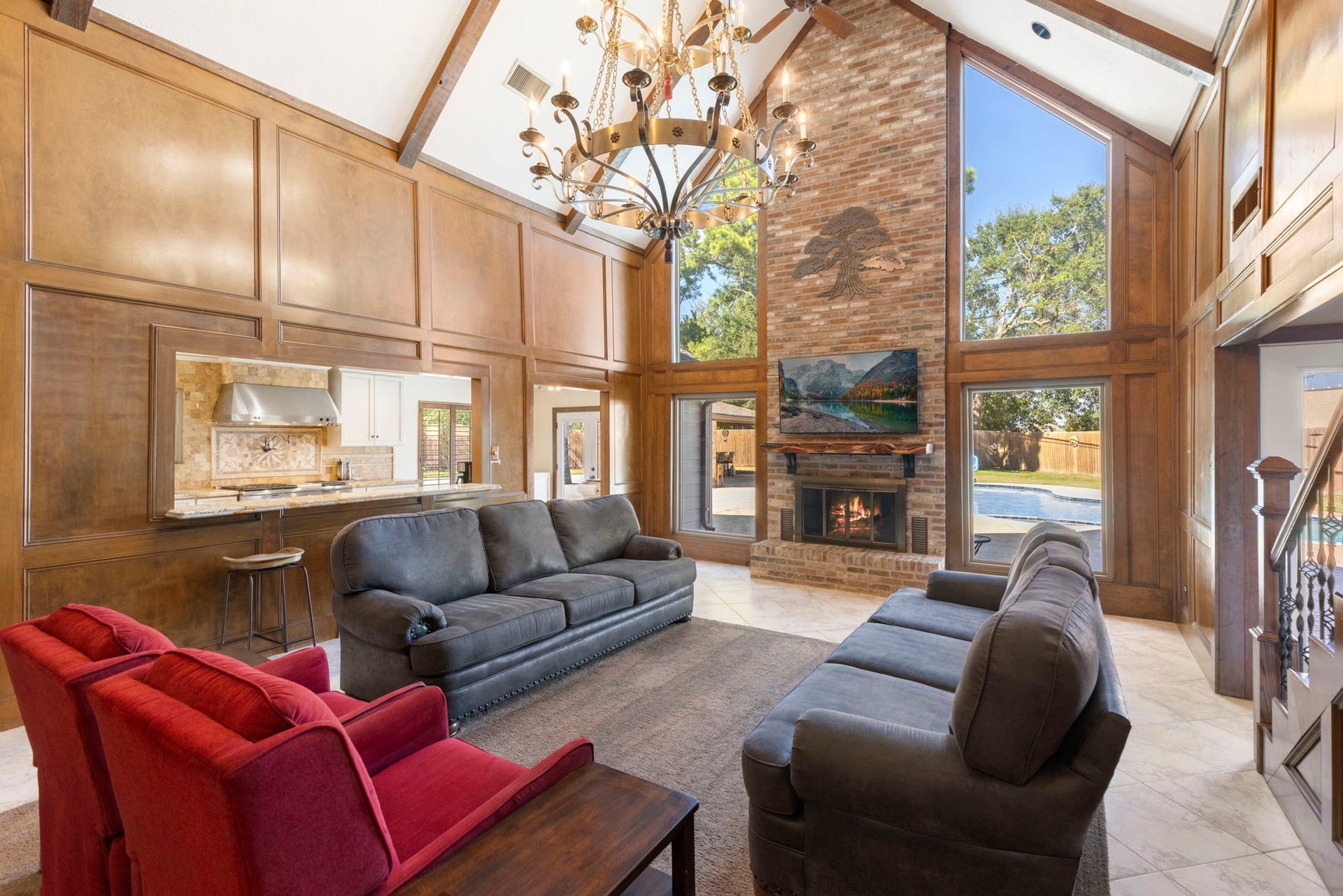 8202 Forest Ridge Road, Spring, TX 77379 Dramatic 2-story den with floor to ceiling windows creating breathtaking views of the backyard.