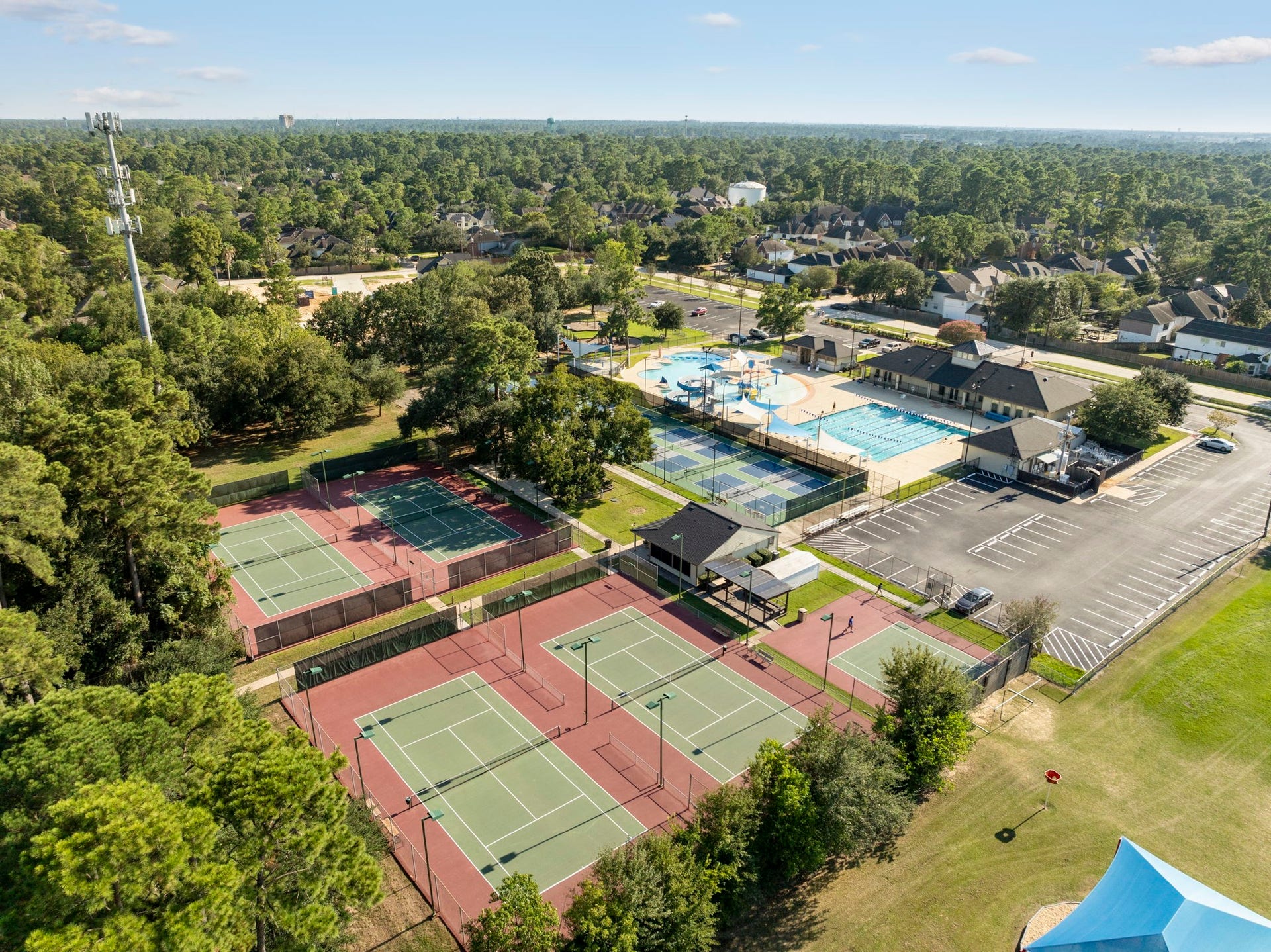 8202 Forest Ridge Road, Spring, TX 77379 12 Lighted Tennis Courts fenced for viewing, Clubhouse w/Fitness Center, Childrens Playground, Mile Jogging Track & more.