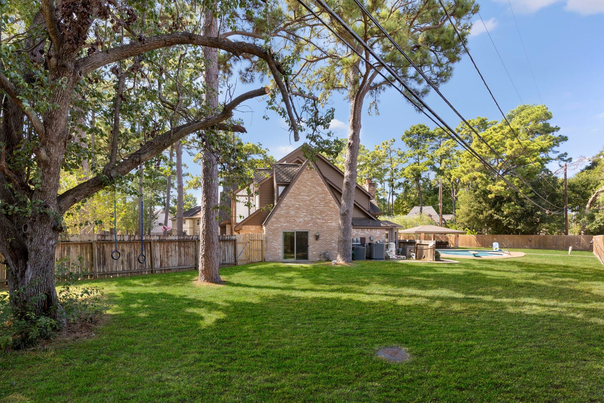 8202 Forest Ridge Road, Spring, TX 77379 In addition to the pool, basketball court and outdoor kitchen is this massive amount of greenspace for kids and pets to run around.