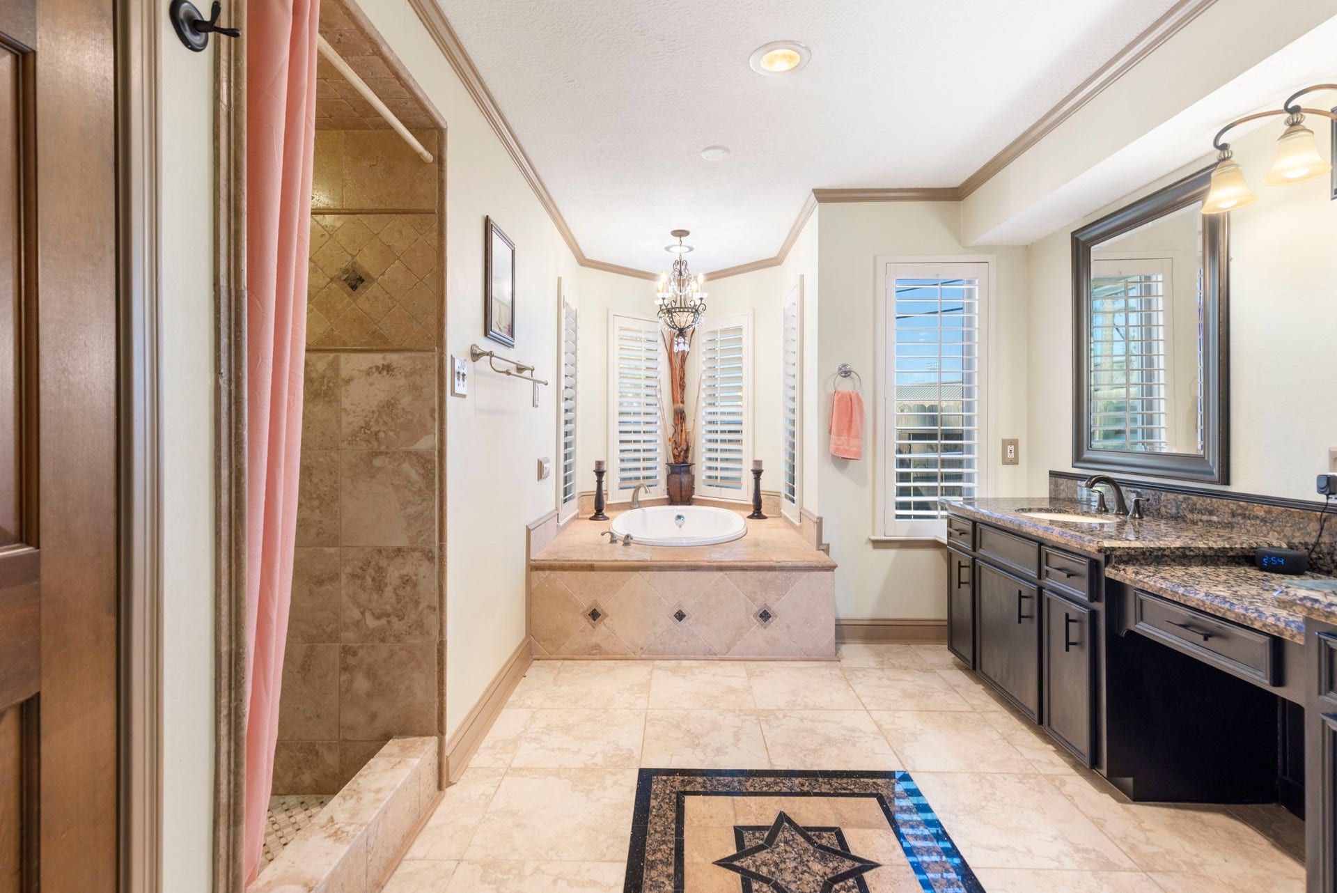 8202 Forest Ridge Road, Spring, TX 77379 Primary bathroom with separate walk-in shower and luxurious corner tub.